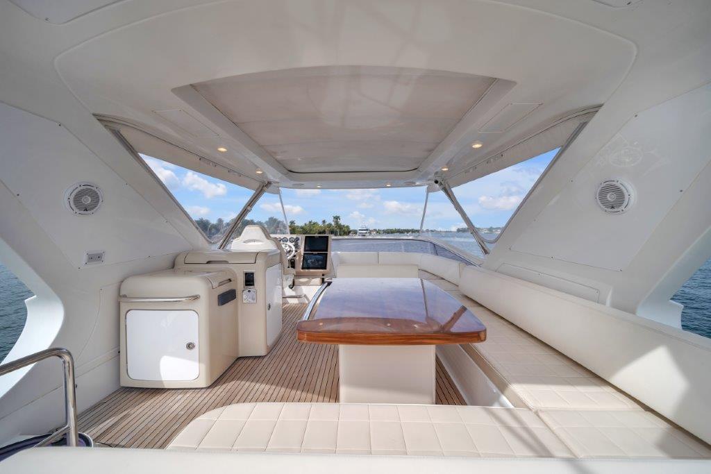 Luxurious 2014 Azimut 64 Flybridge yacht interior with elegant seating and ocean view.