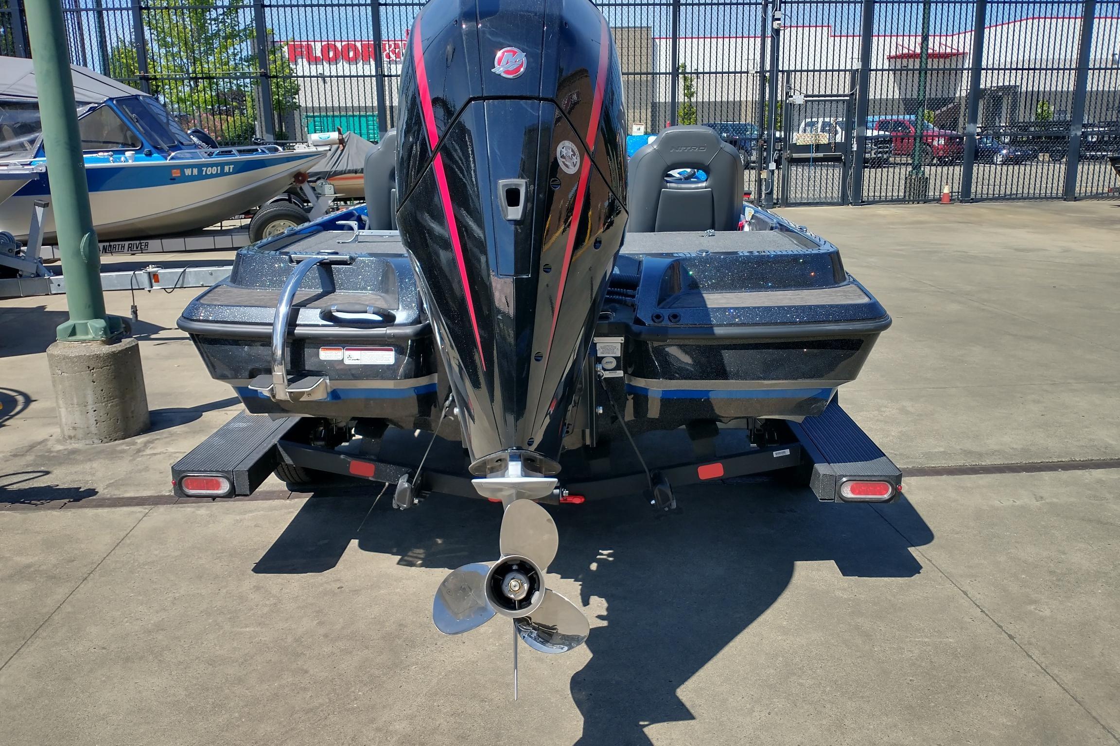 Rear view of a 2026 Nitro Z19 XL boat with a powerful outboard motor.