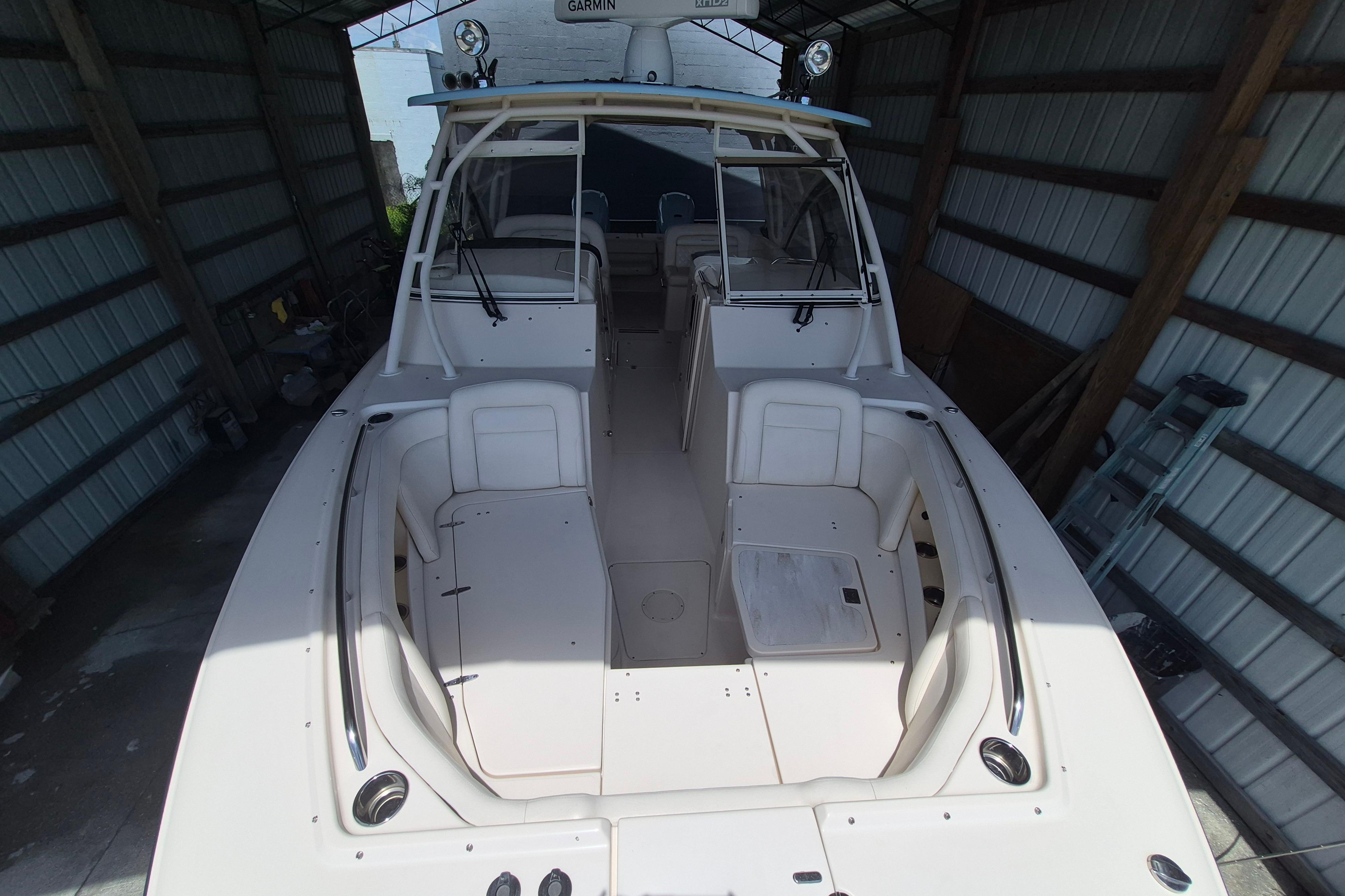 2019 Grady-White Freedom 335 boat in a covered storage area.