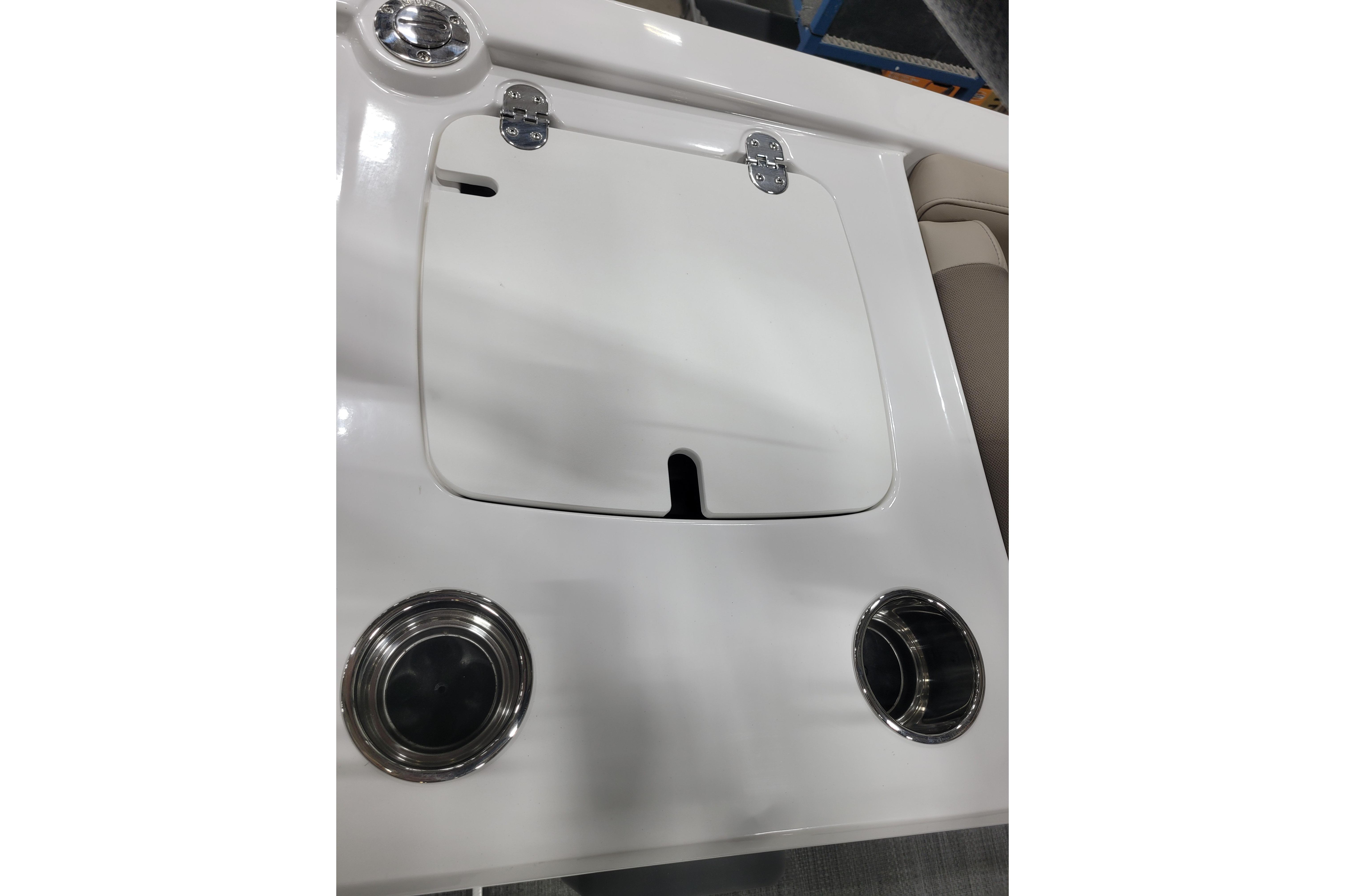 2026 Tahoe 2150 boat interior with storage compartment and cup holders.