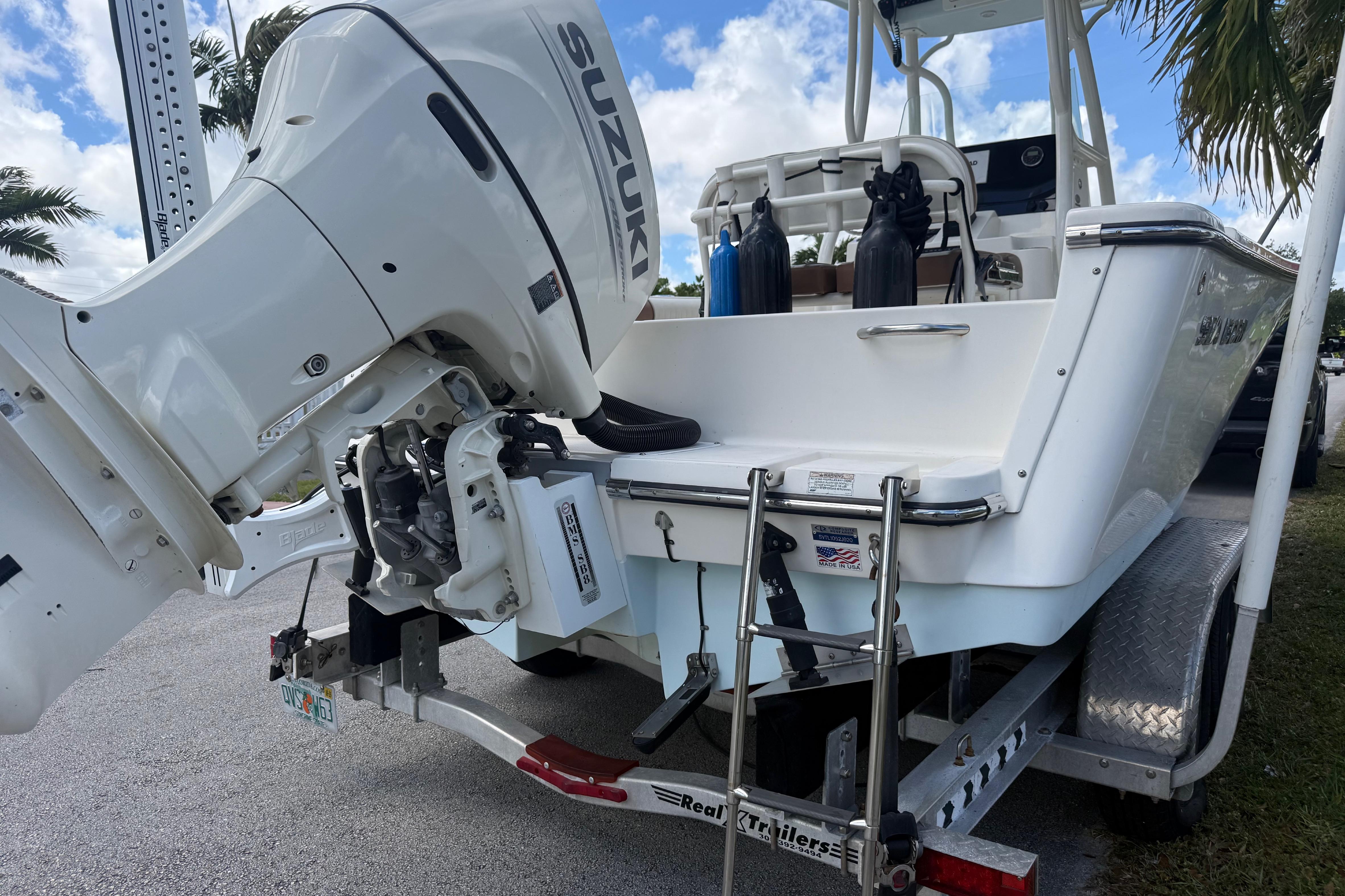 2020 Sea Pro 210 Center Console boat with Suzuki outboard motor on trailer.