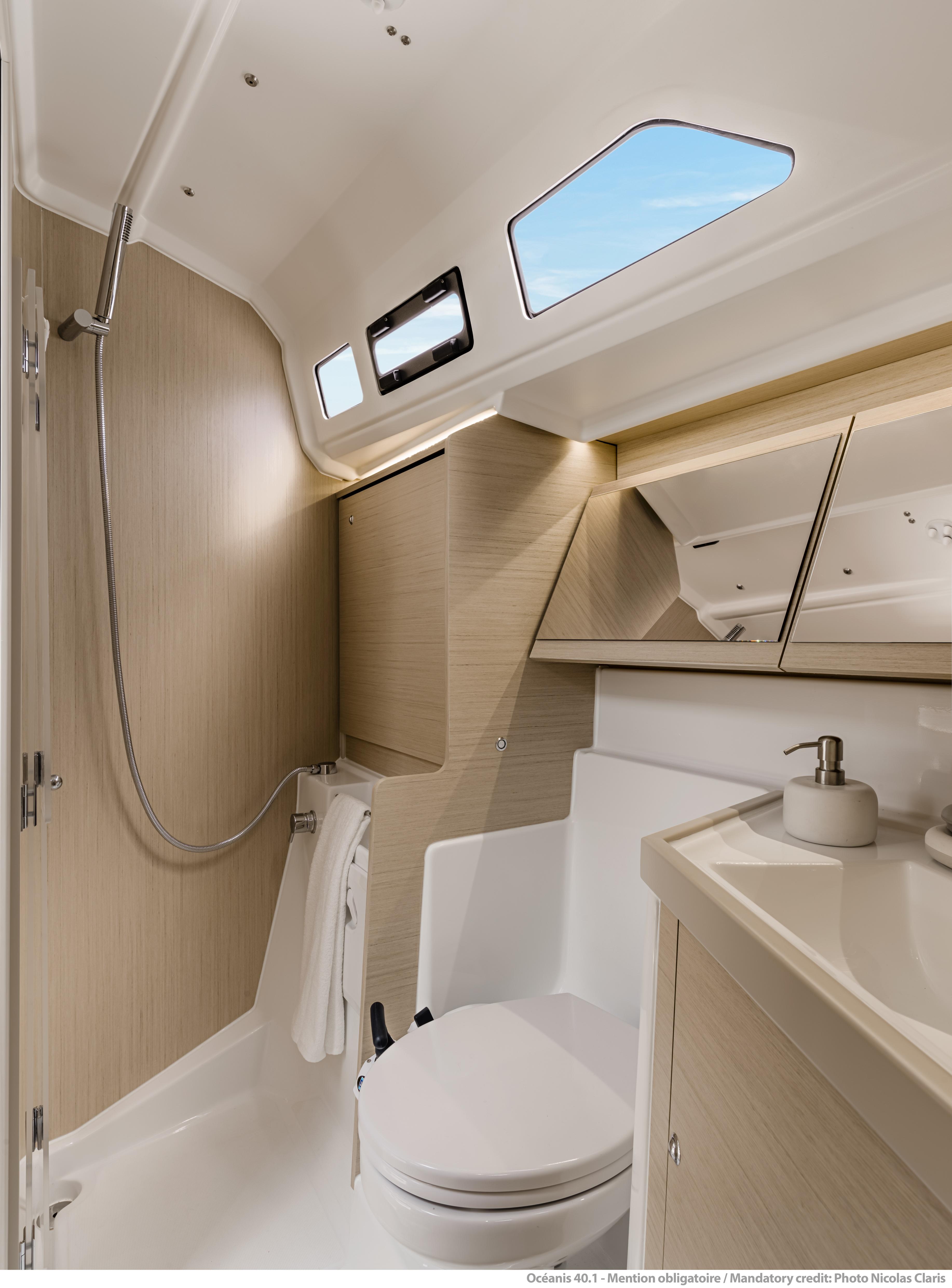 2025 Beneteau Oceanis 40.1 yacht bathroom with modern fixtures and natural lighting.