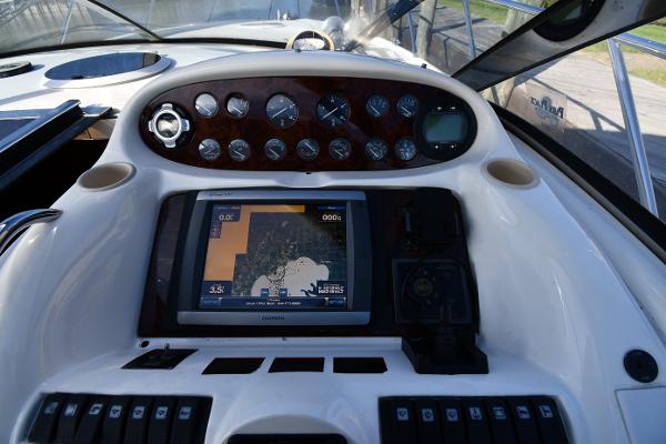 Control panel of 1997 Sunseeker Camargue 47 yacht with navigation display and gauges.