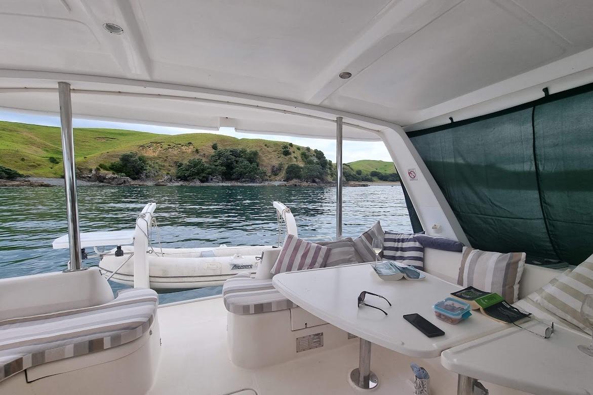 Luxurious 2007 Leopard 43 yacht interior with scenic water and hillside view.