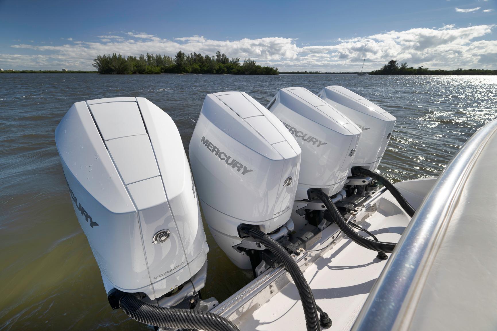 2024 Bahama 41 RD boat with four Mercury outboard engines on a sunny day.
