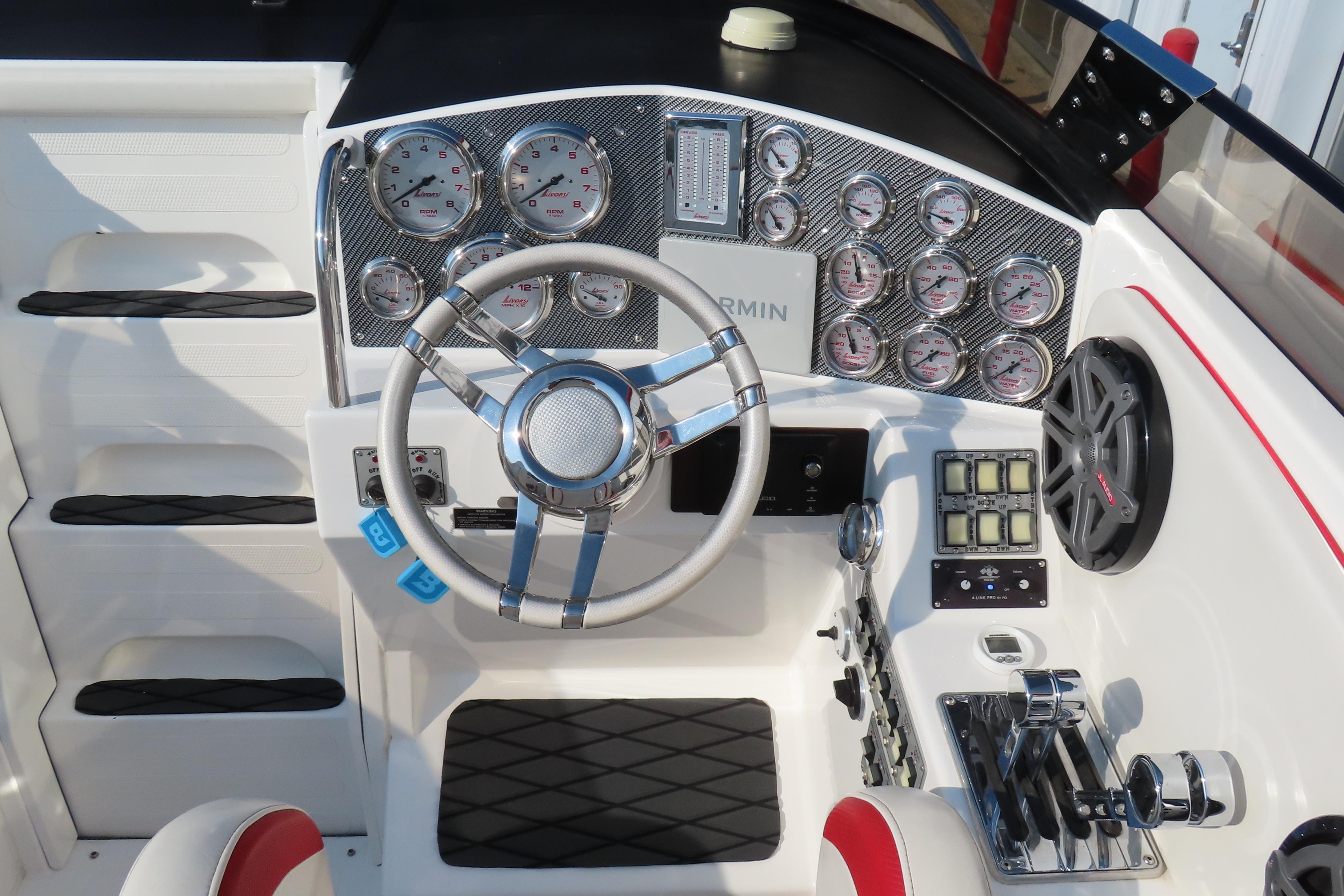 Cockpit of 2013 Nordic 39 POKER RUN boat with steering wheel and gauges.