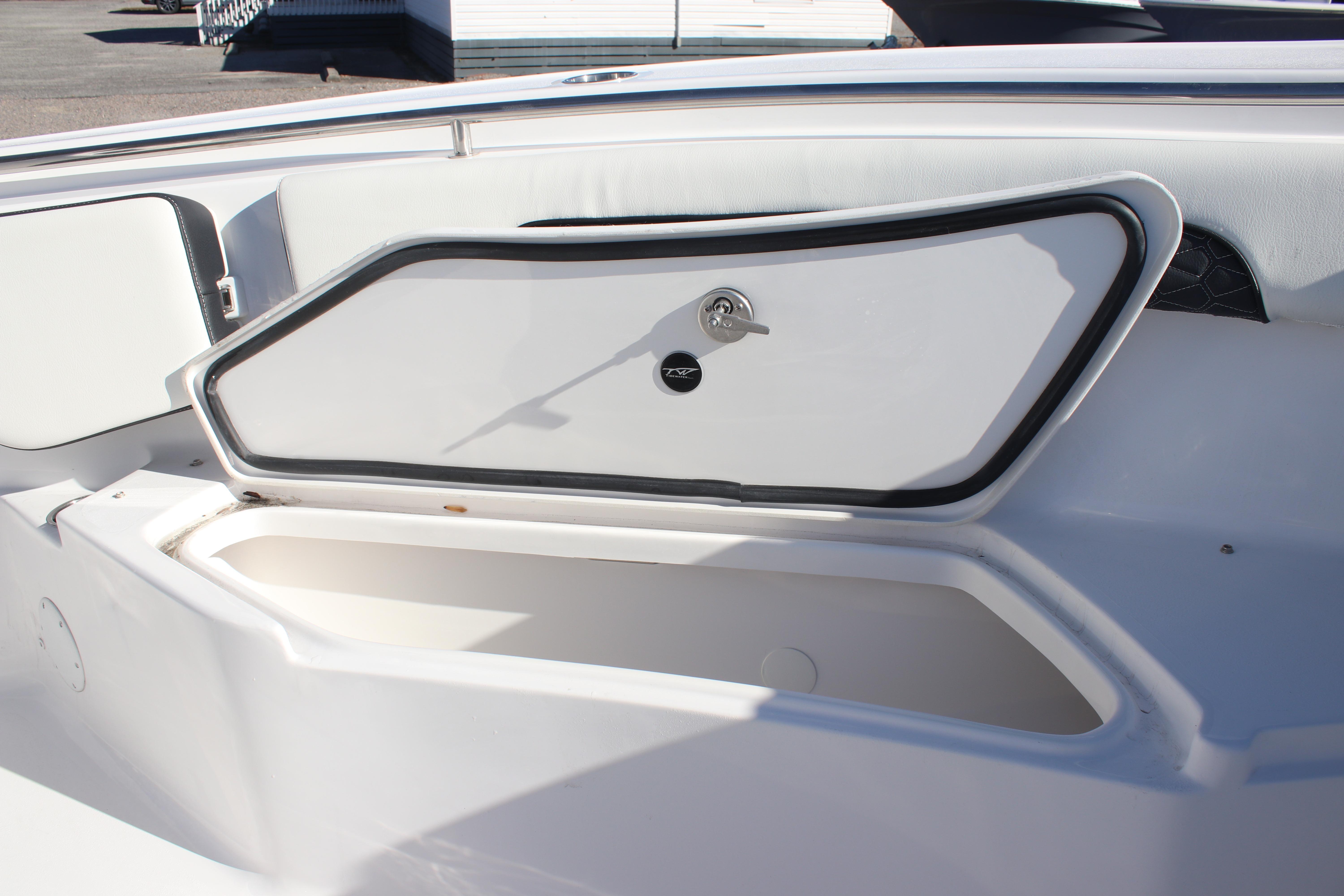 2026 Tidewater 232 CC Adventure boat storage compartment with secure latch.