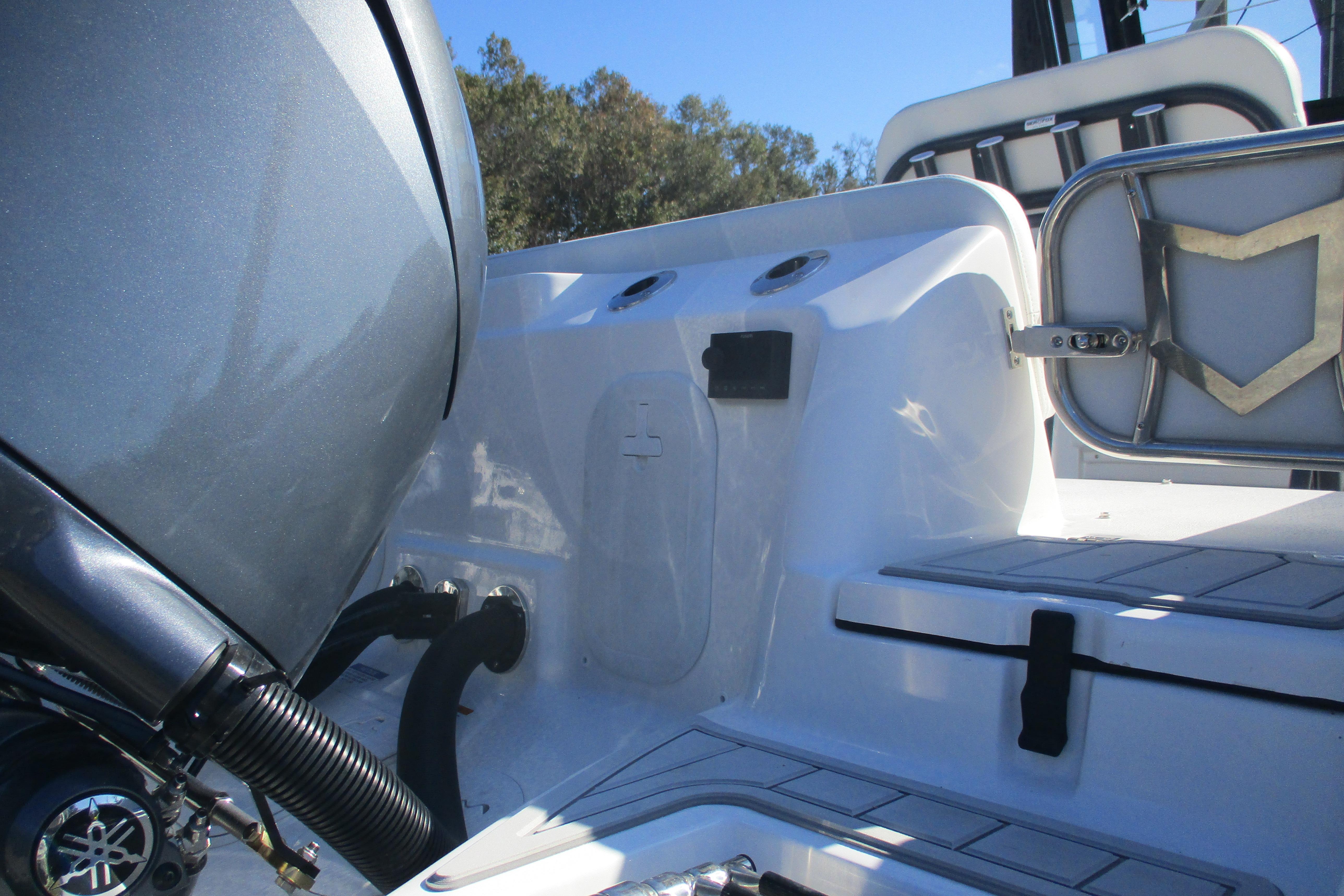2026 Sea Fox 268 Commander boat interior with engine and seating details.