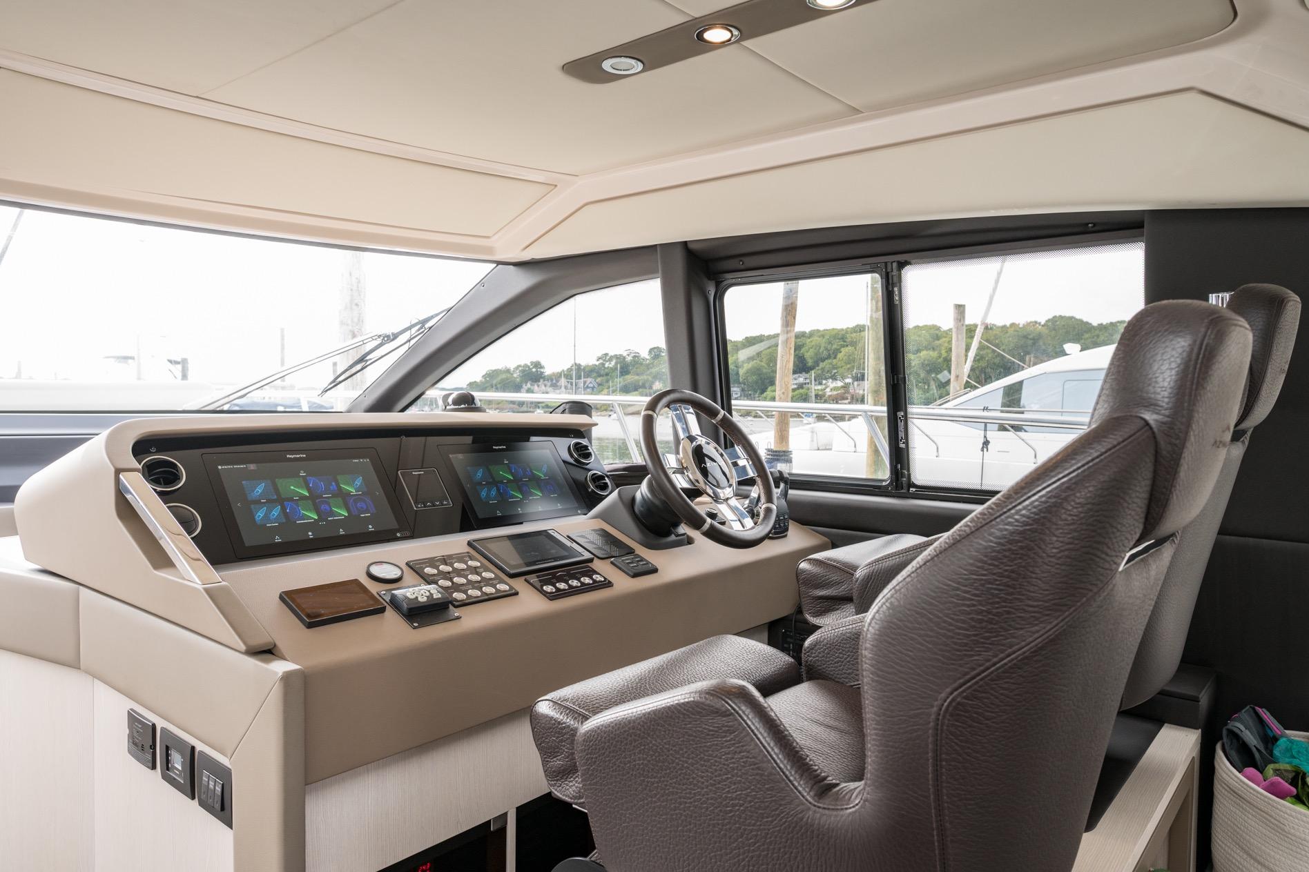 Luxurious helm of 2020 Azimut Fly 50 yacht with advanced navigation controls.