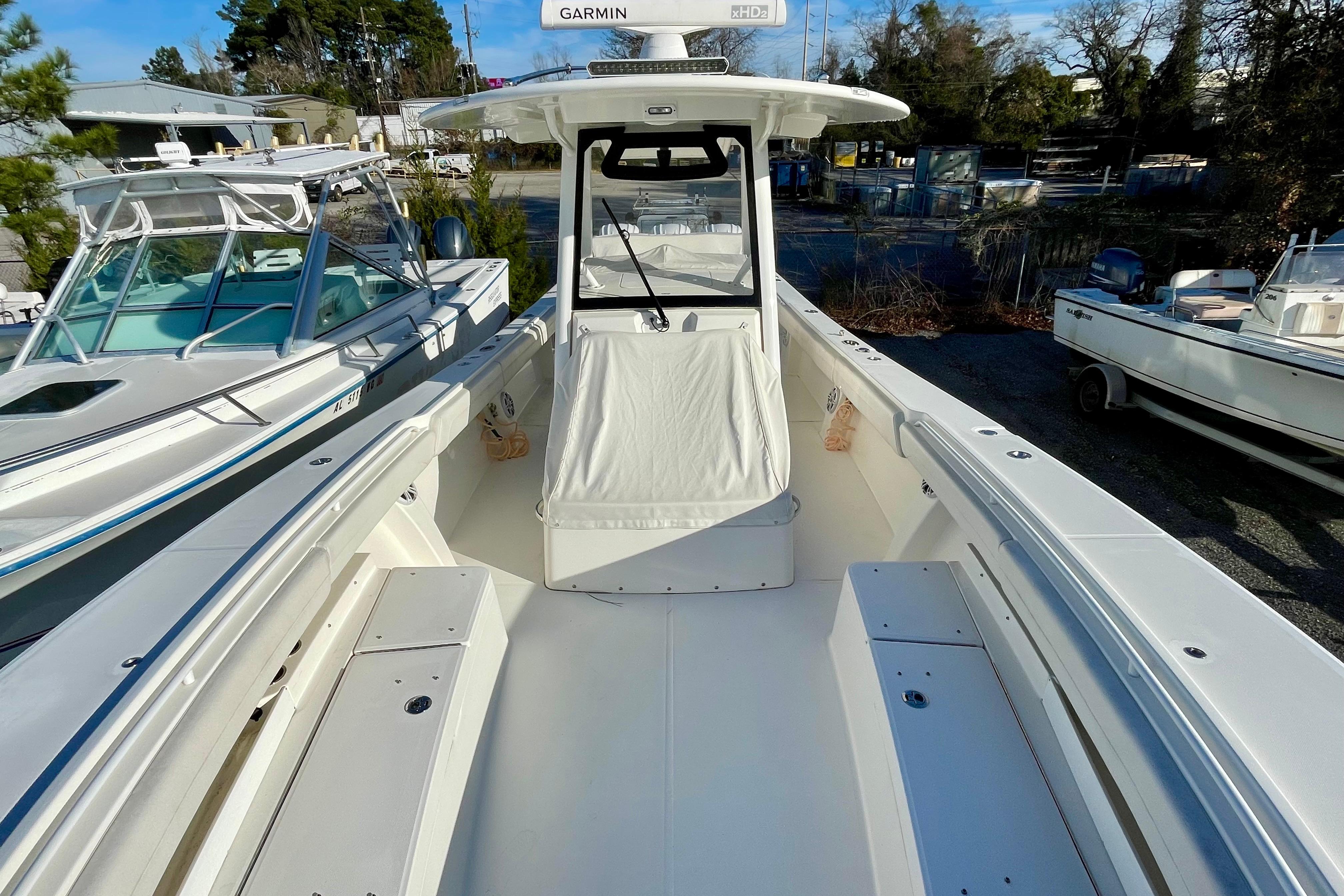 2023 Regulator 34 boat with spacious deck and modern design in a marina setting.