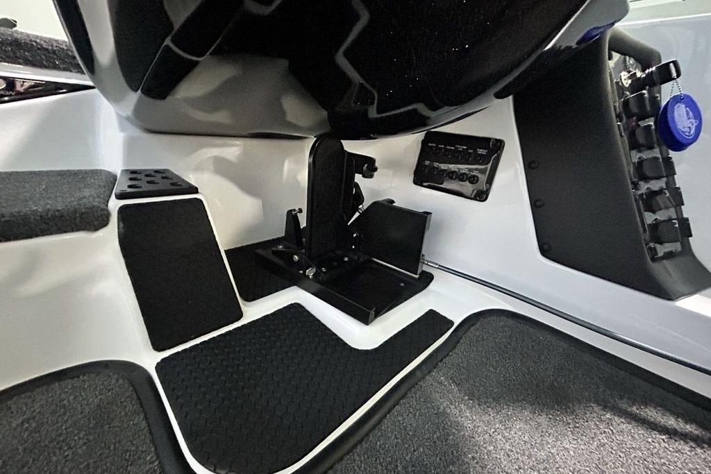 Interior view of 2026 Phoenix 818 Pro boat cockpit with pedals and control panel.