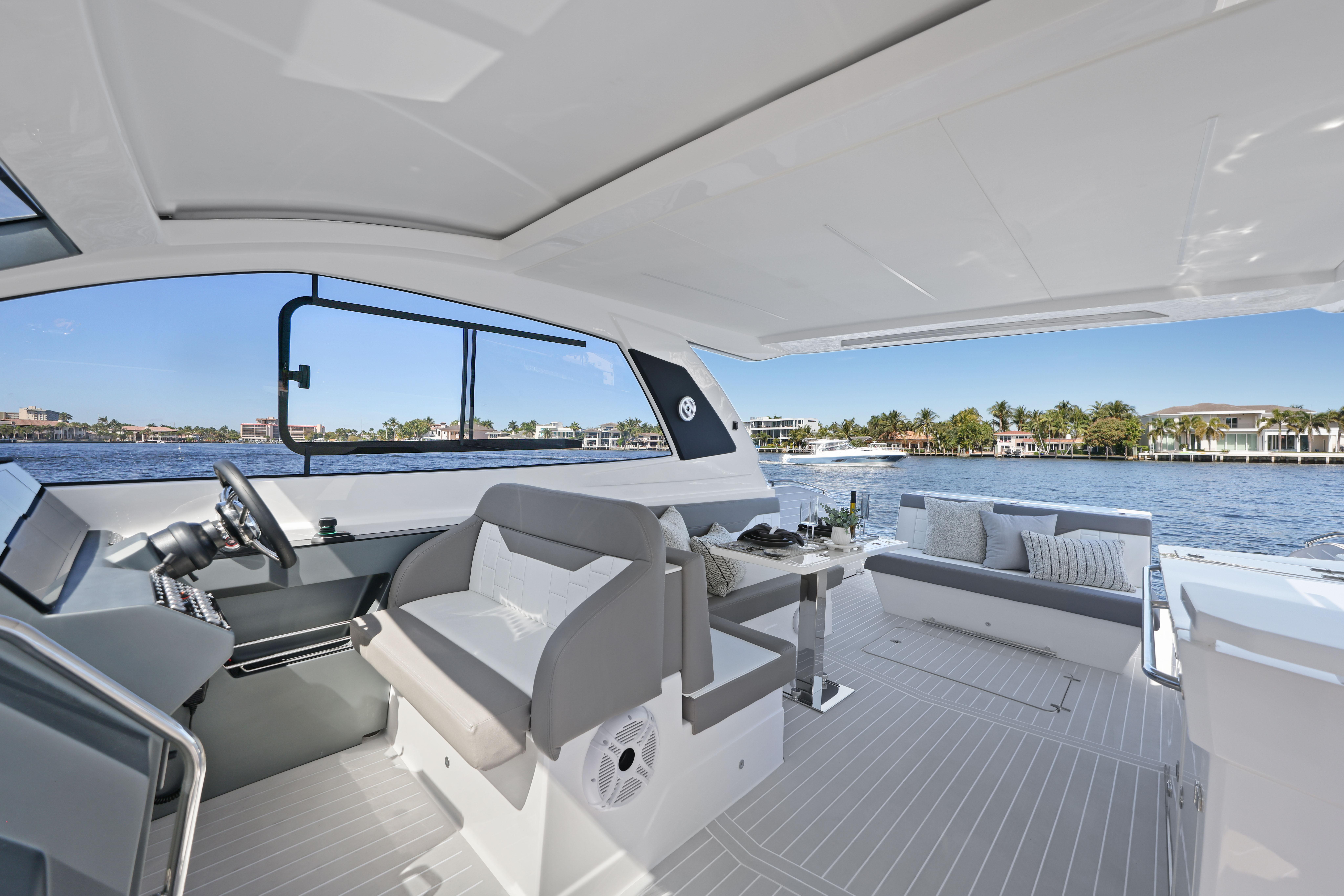 2025 Valiatt 380 Bowrider interior with modern seating and scenic waterfront view.