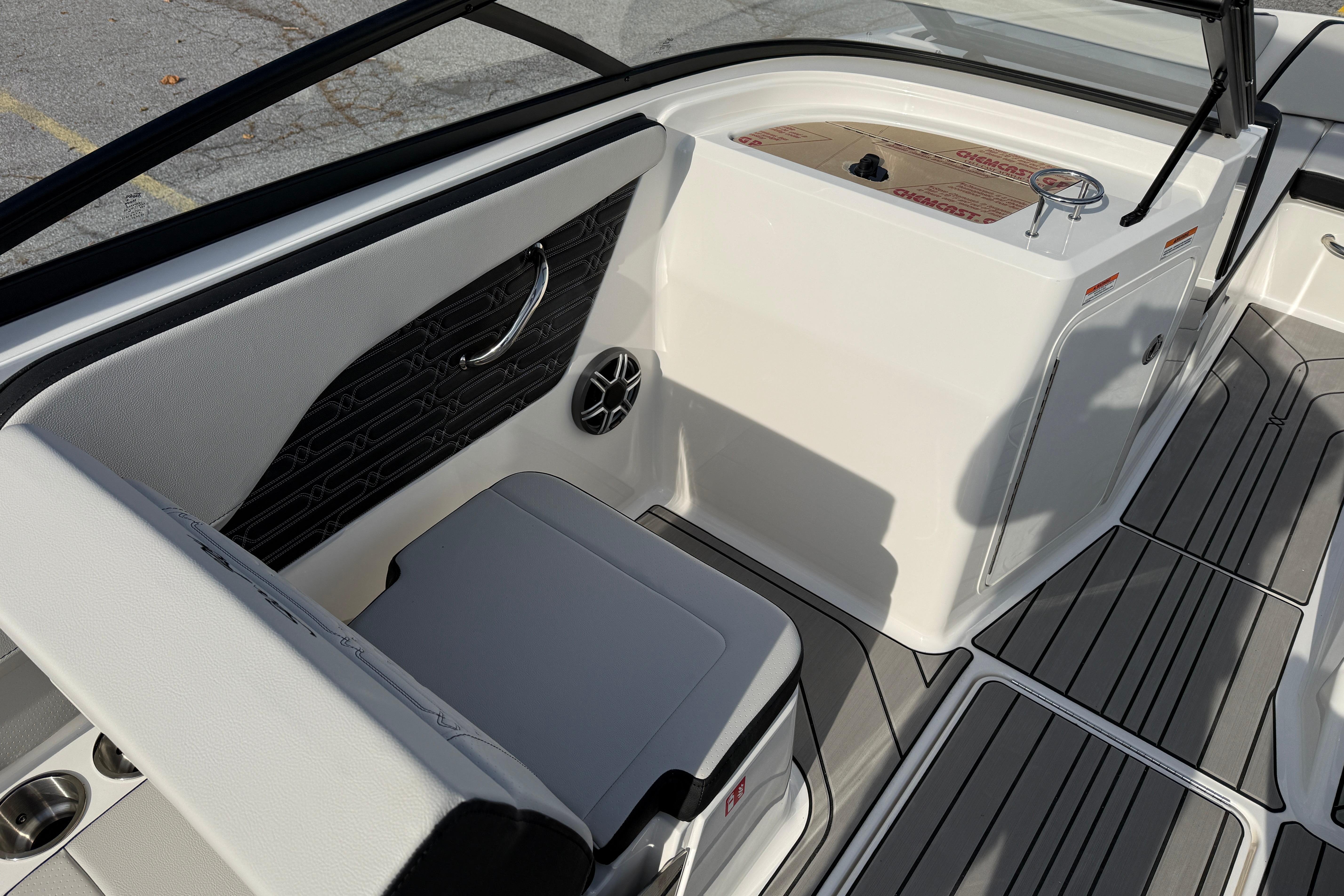 2026 Sea Ray SPX 210 Outboard boat interior with seating and control panel.