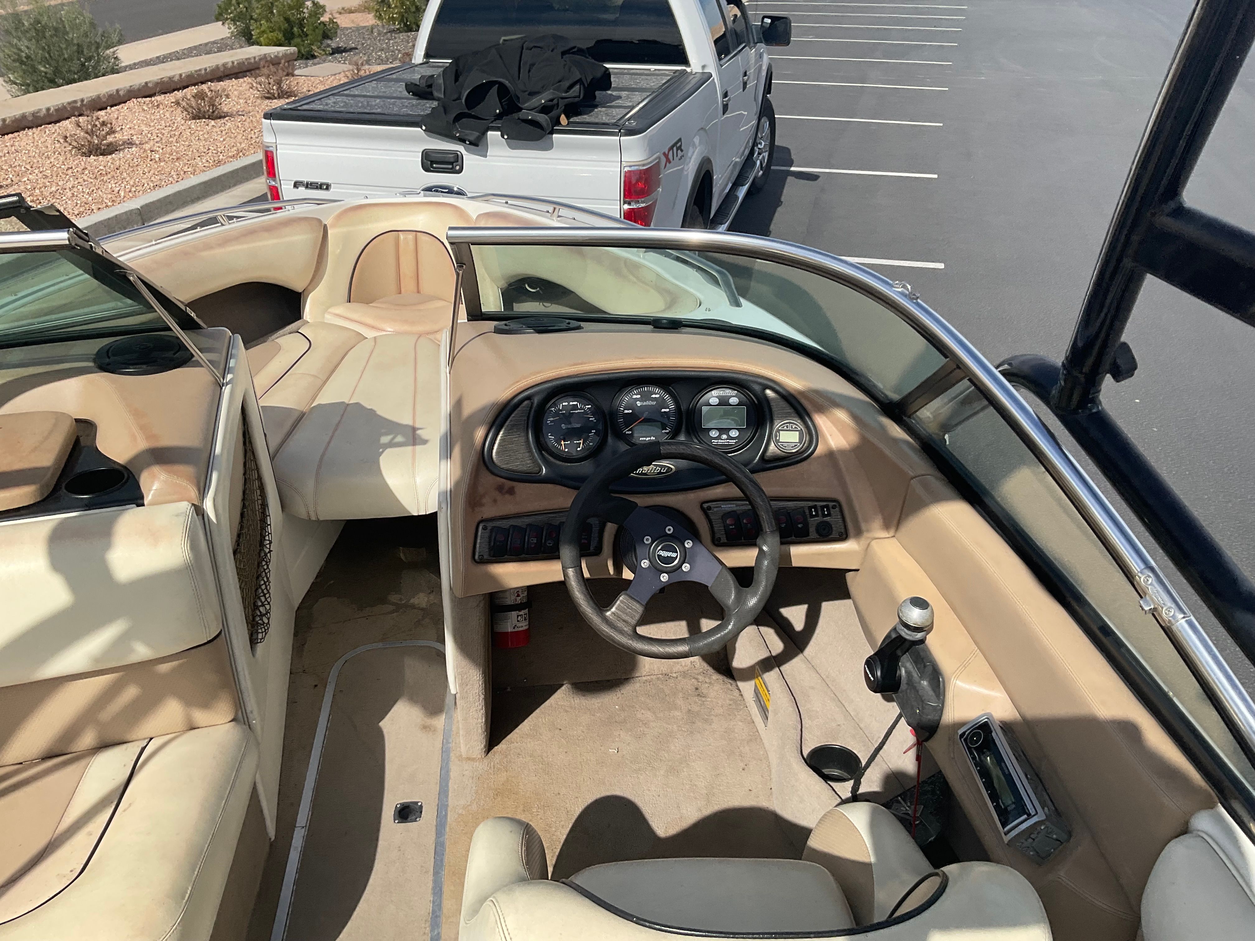 Interior view of a 2003 Malibu Wakesetter 23 LSV with steering wheel and dashboard.