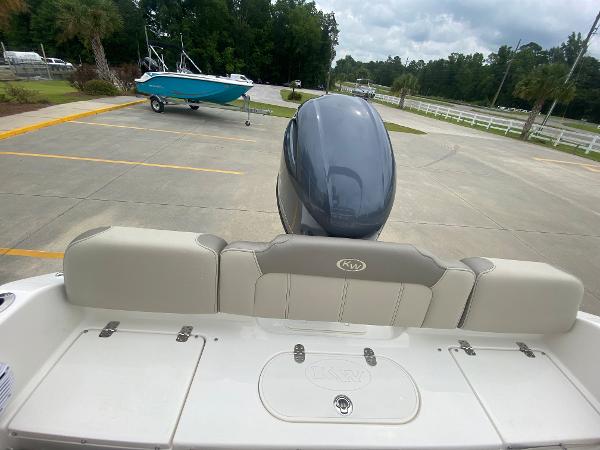 2024 Key West 189 FS boat with outboard motor in parking lot.