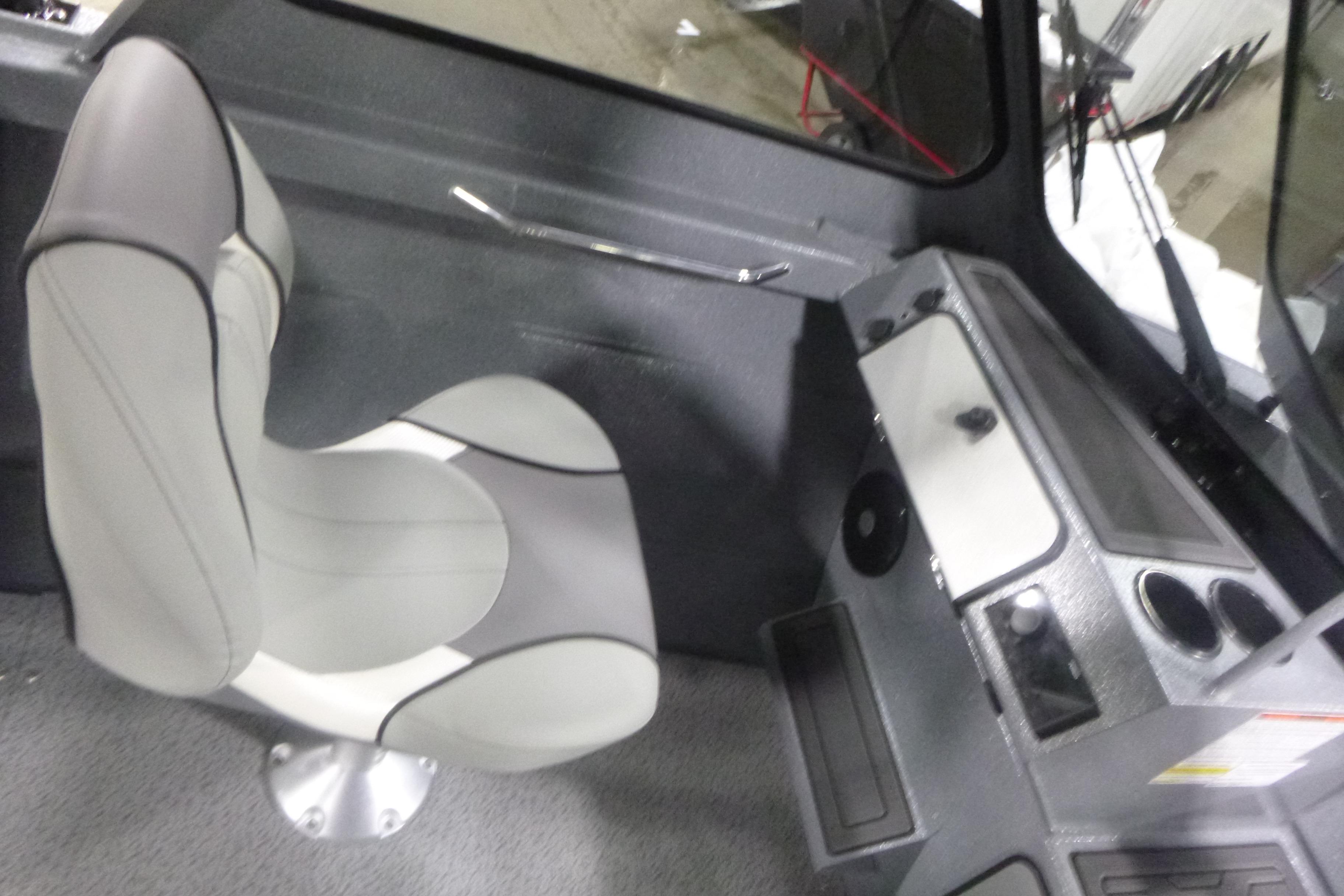 Interior of 2026 KingFisher 2025 Falcon boat with modern seating and dashboard.