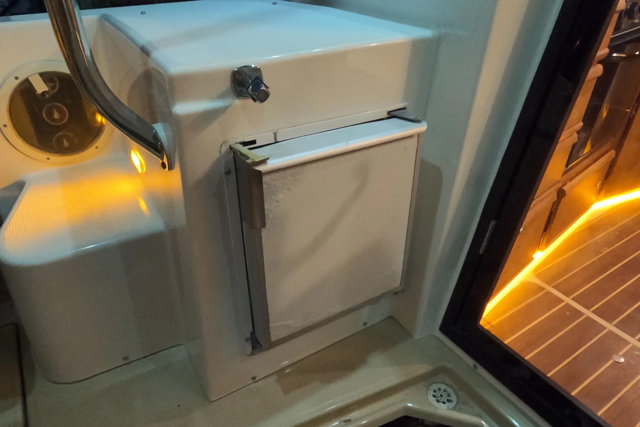 2015 Ranger Tugs R-29 S interior with illuminated deck and storage compartment.