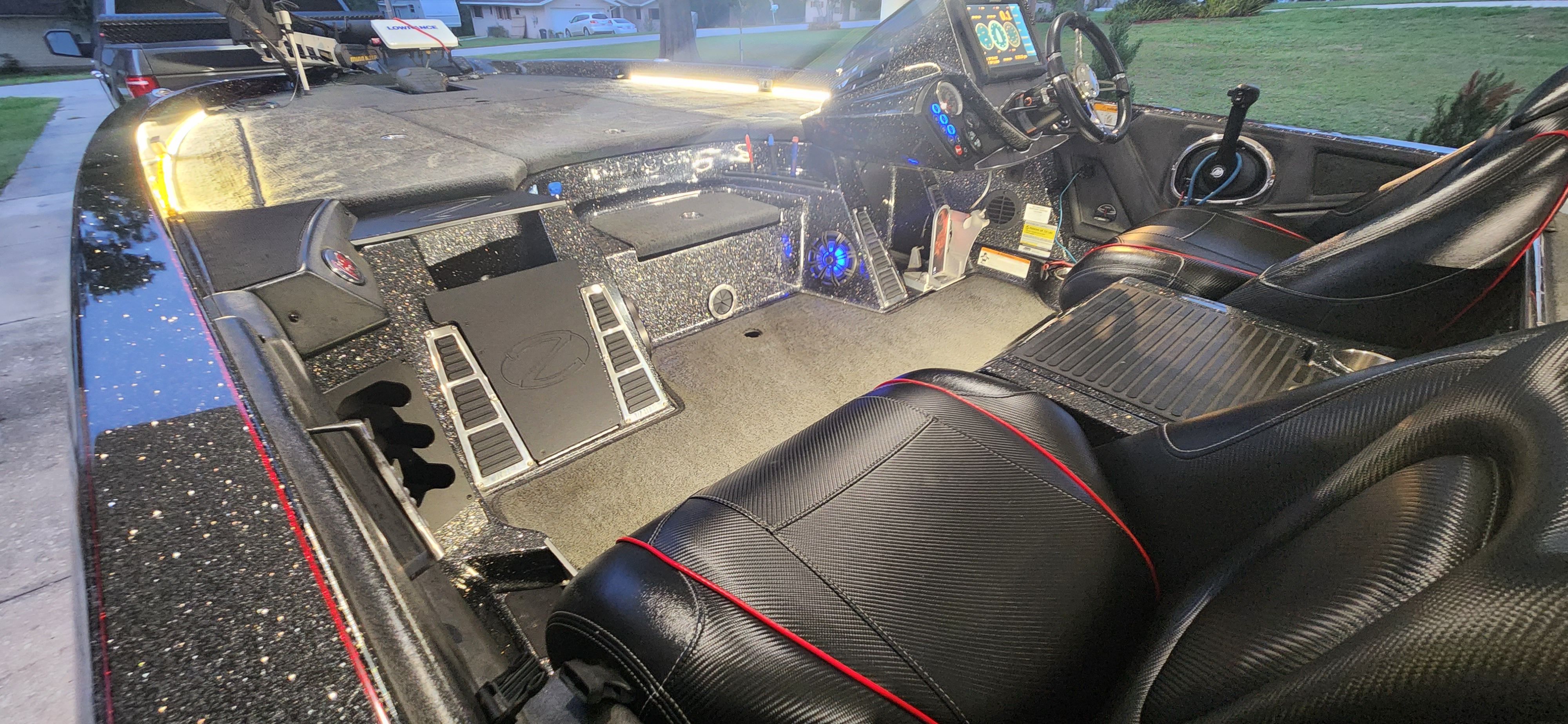 The image shows the cockpit of a 2017 Ranger Z520 Comanche with modern instruments and black seats.