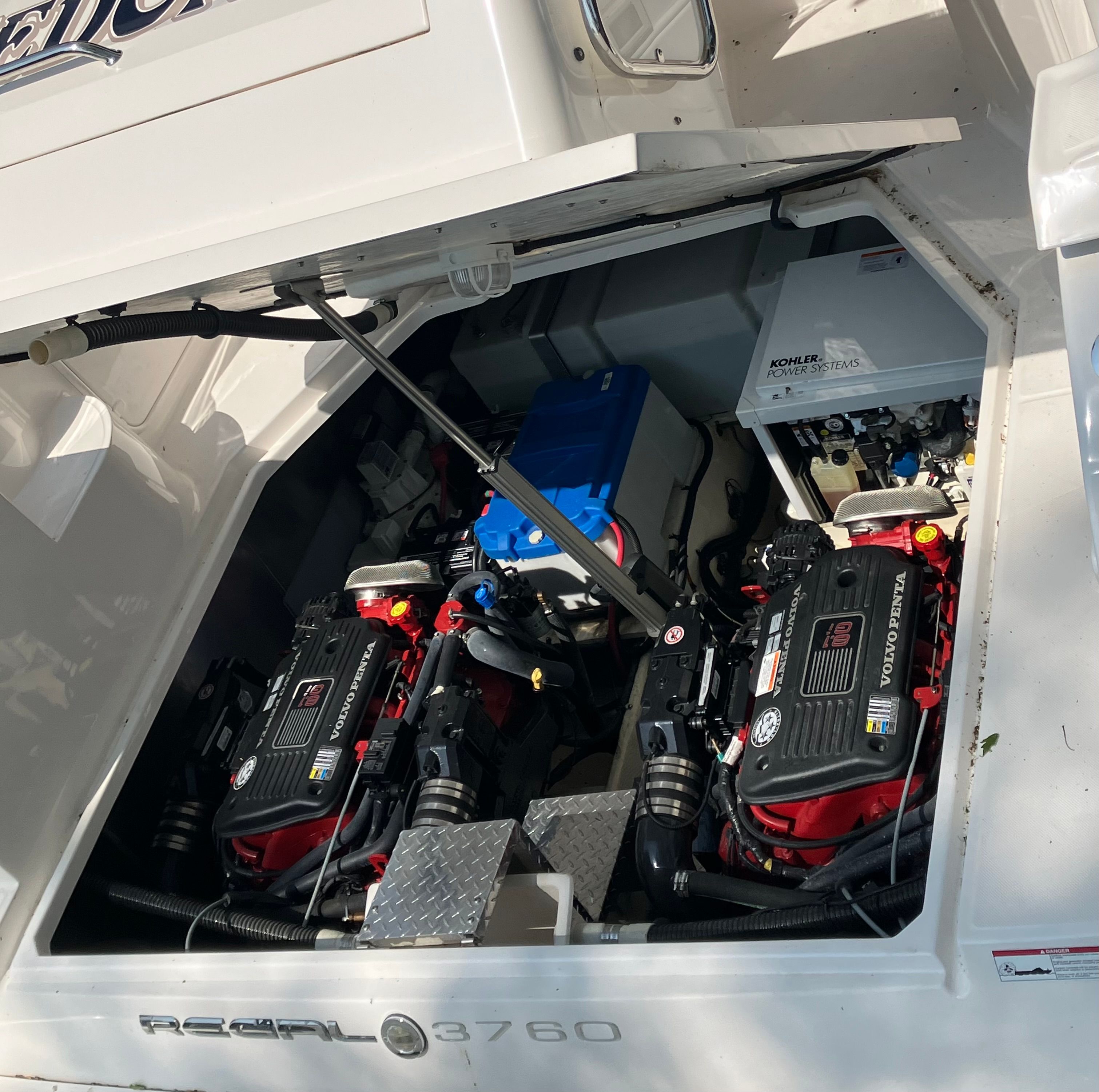 Engine compartment of a 2008 Custom Commodore boat with Volvo Penta engines.