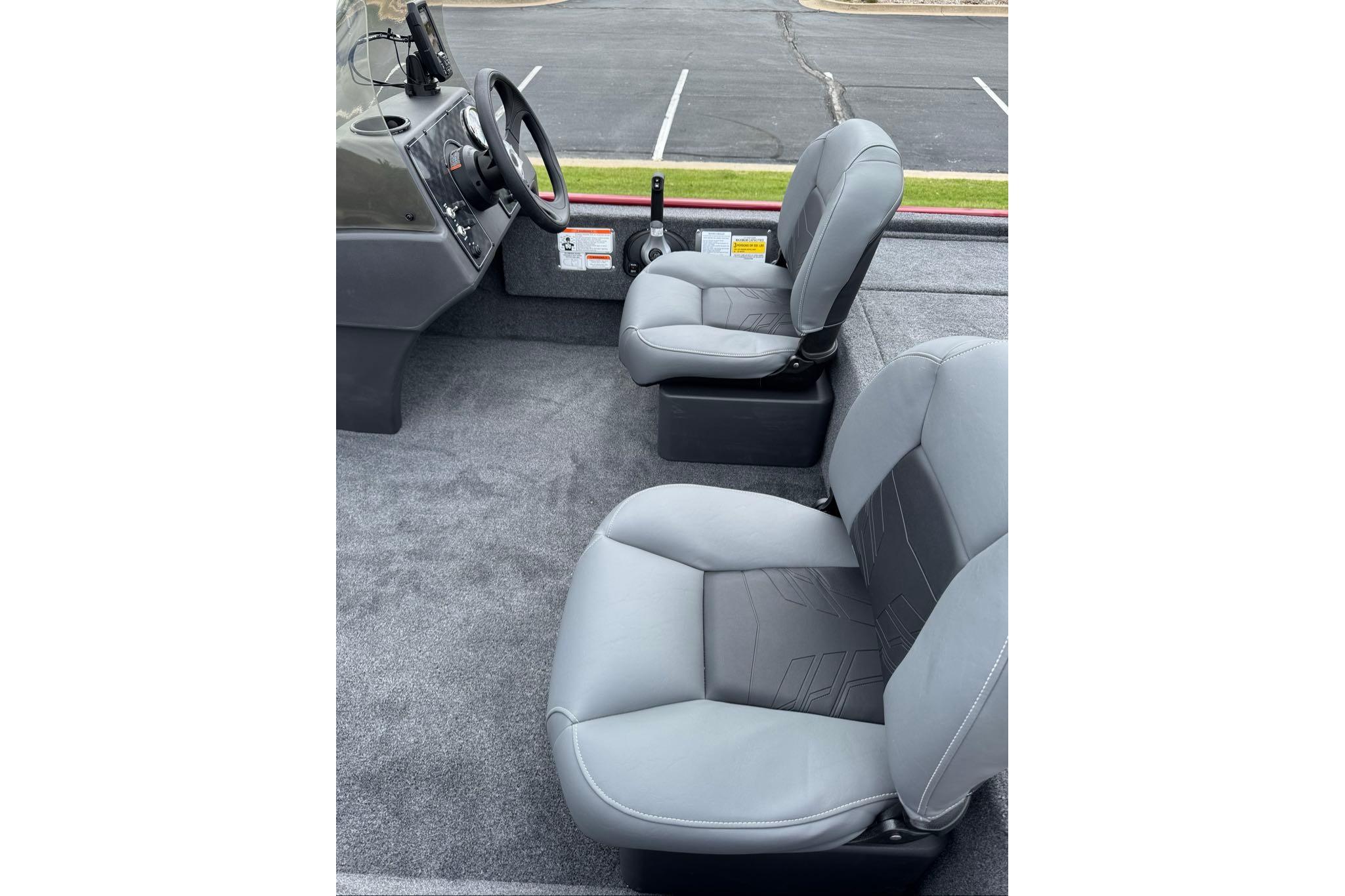 2026 Tracker Bass Tracker Classic XL boat interior with gray seats and steering console.