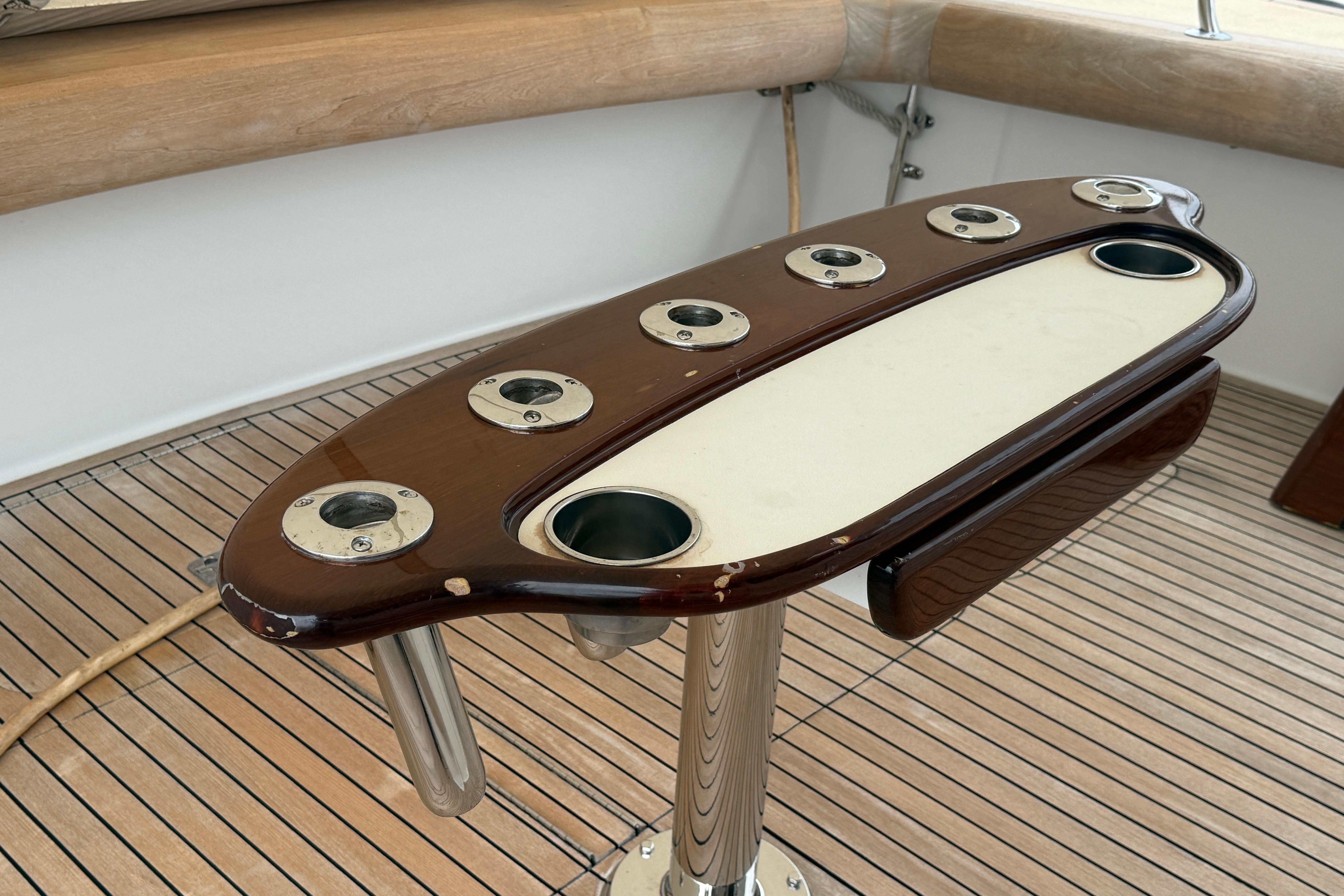 Fishing rod holders on a 2000 Viking 55 Convertible yacht's deck.
