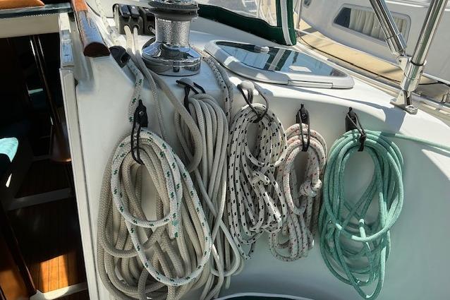 Coiled ropes on a 2000 Beneteau Oceanis 321 sailboat deck.