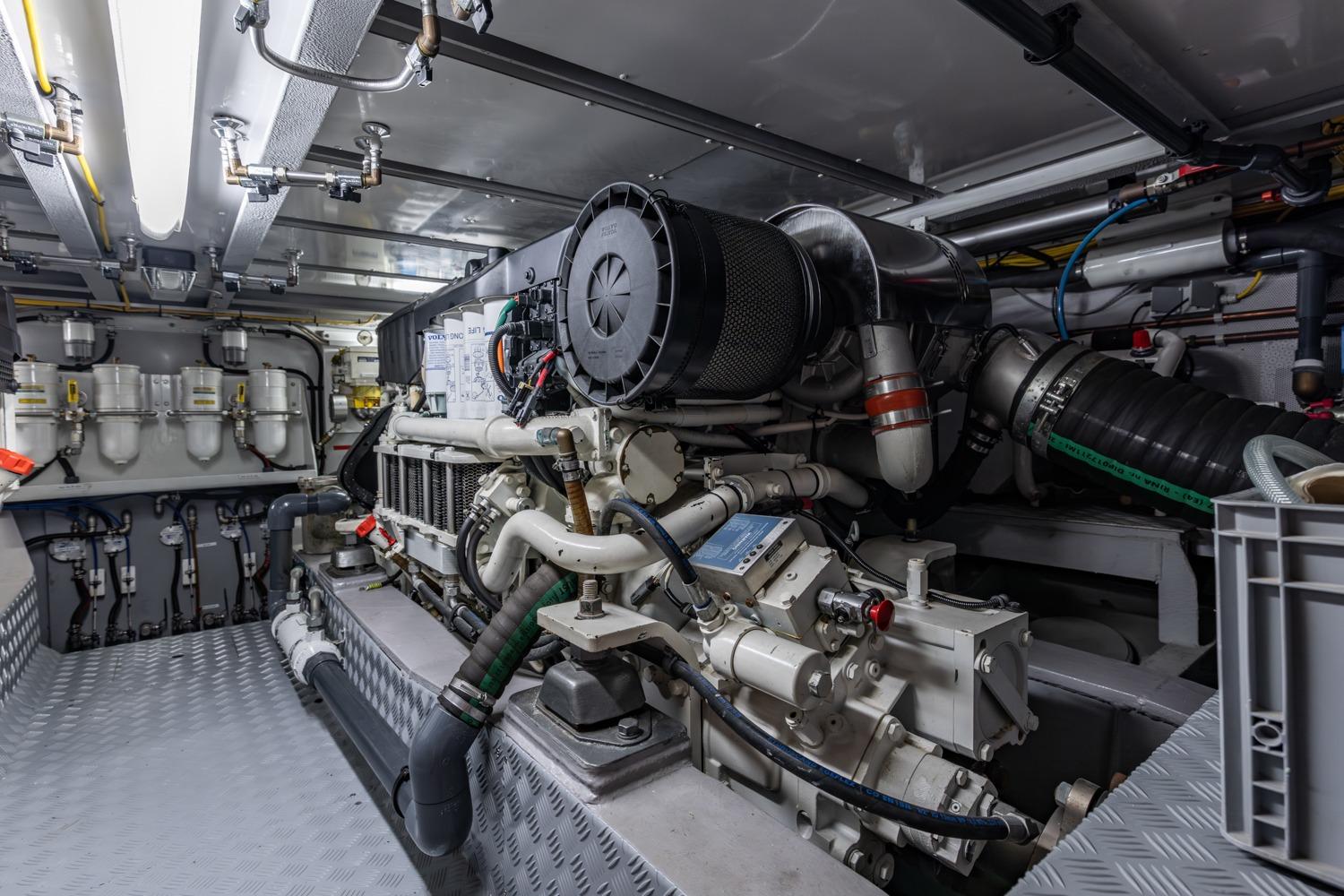 Engine room of 2013 Valk Continental 2000 Aluminium yacht, showcasing complex machinery and piping.