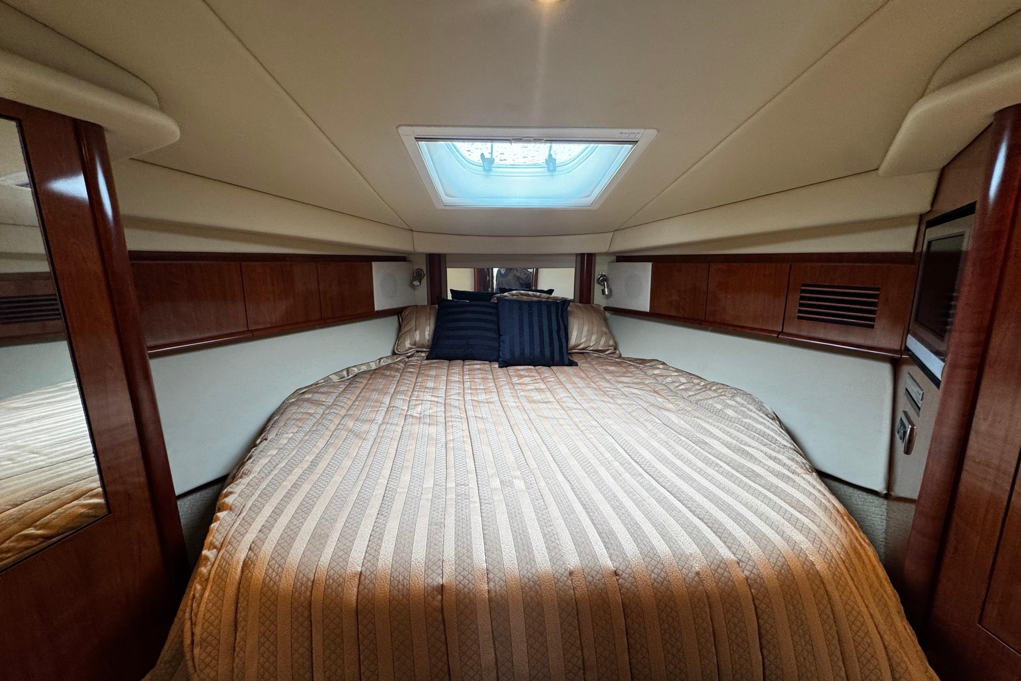 Luxurious cabin interior of 2006 Sea Ray 40 Sundancer yacht with skylight.