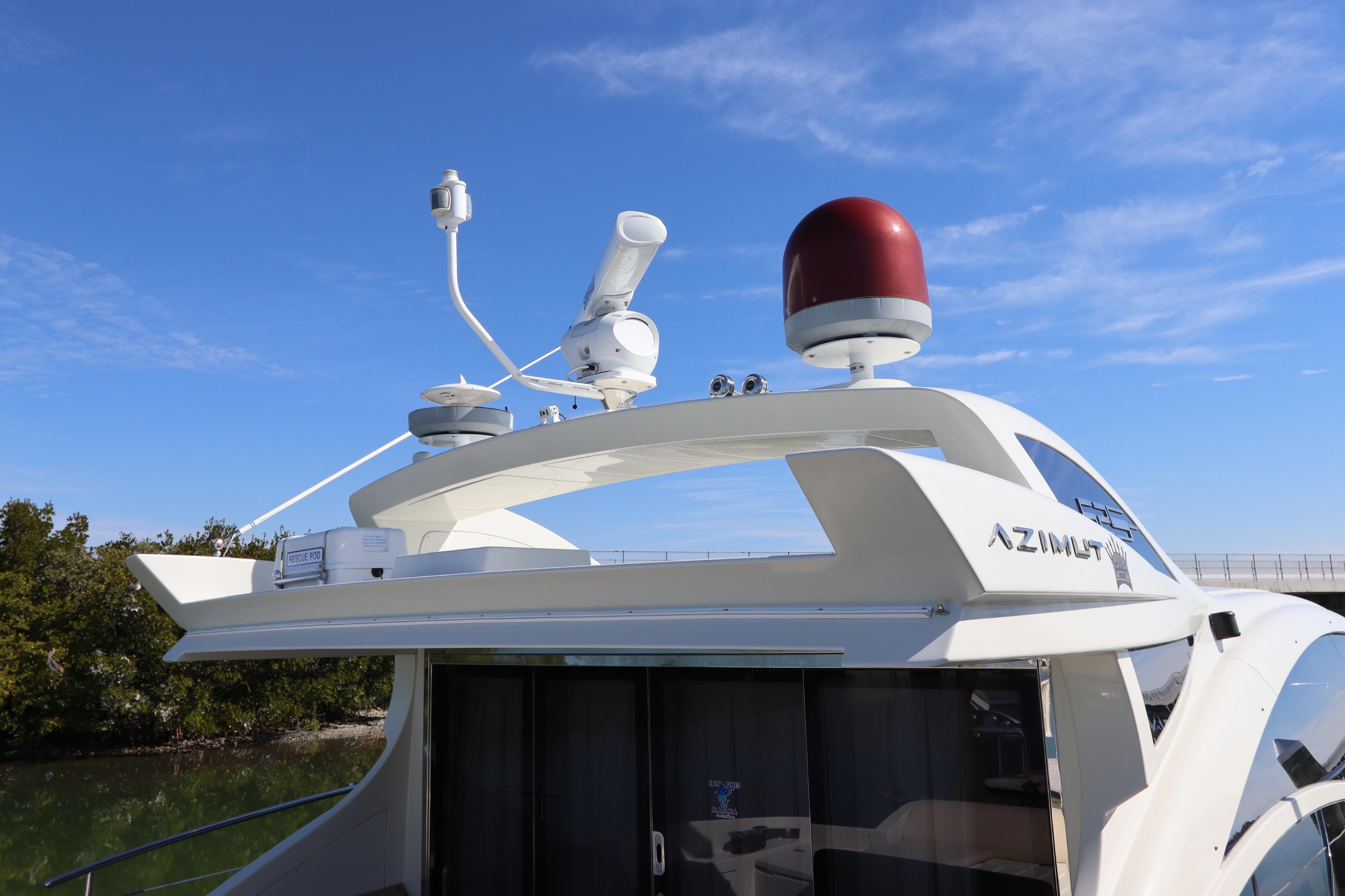 2007 Azimut 62S yacht with radar equipment against a clear blue sky.