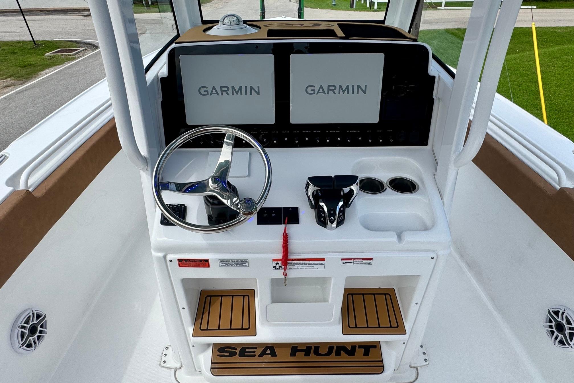 Helm of 2026 Sea Hunt Ultra 275 SE with Garmin displays and modern controls.