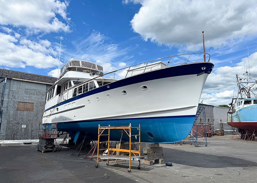 A 1961 Burger 63 yacht is on a dry dock for maintenance.