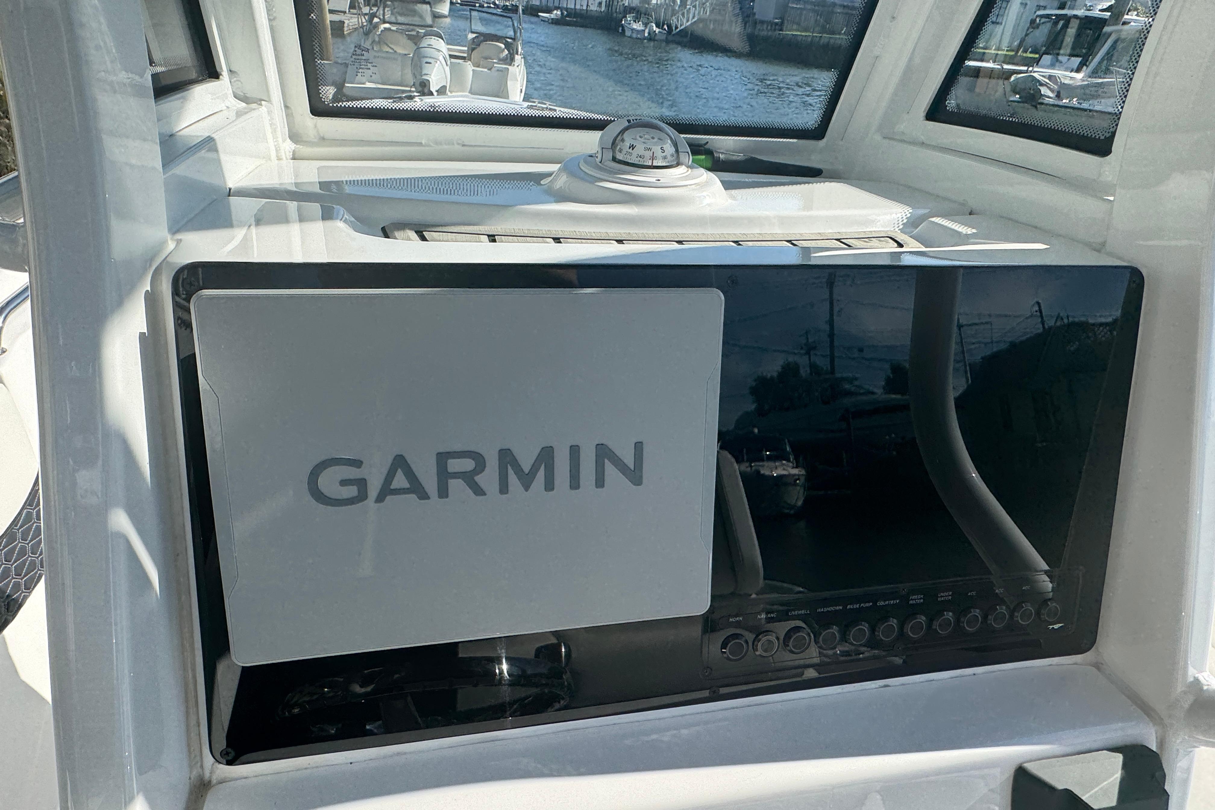 2025 Tidewater 232 LXF boat dashboard featuring a Garmin navigation system.