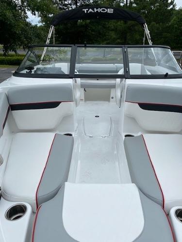 2024 Tahoe 210 Si boat interior with white and gray seating, black canopy.