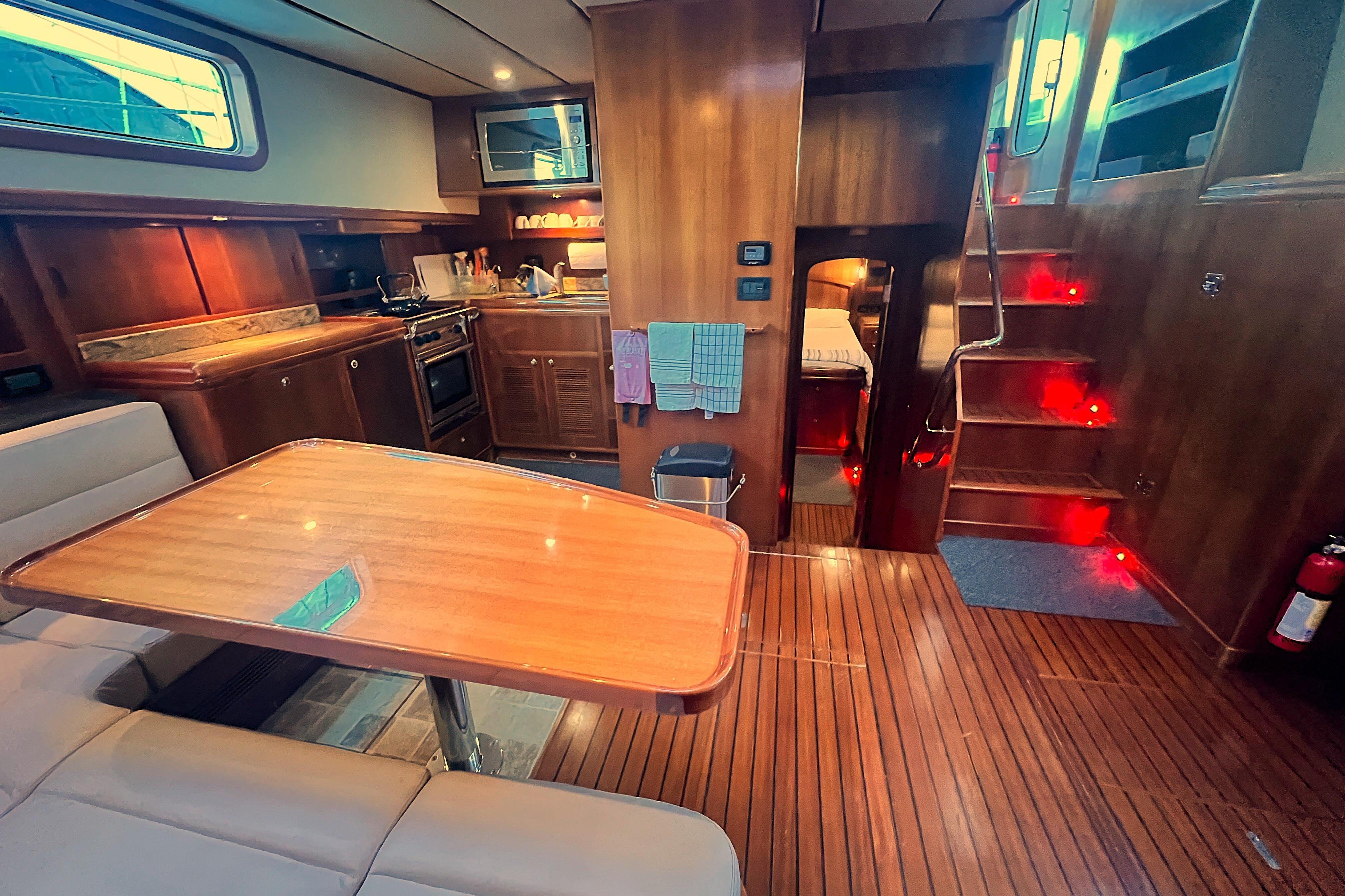 Luxurious interior of 2009 Nordhavn 56 Motorsailer with wood finishes and modern amenities.