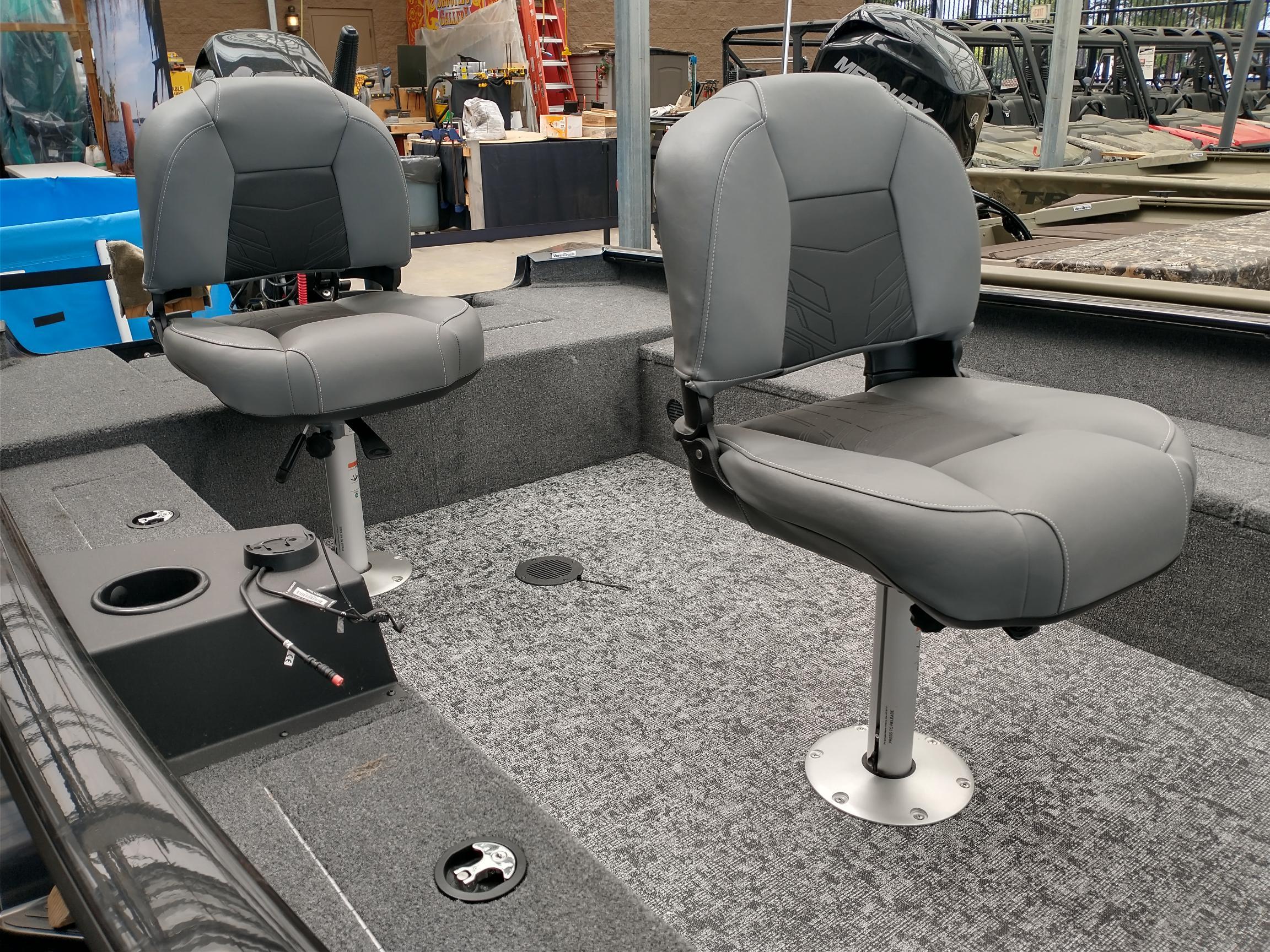 2025 Tracker Super Guide V-16 T boat interior with two gray swivel seats.
