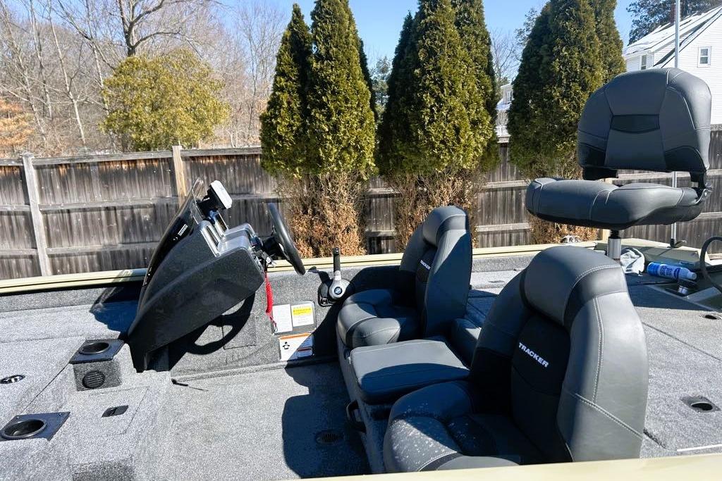 2026 Tracker Pro Team 175 boat interior with seats and steering console.