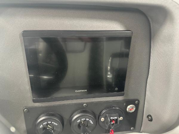 Dashboard of 2025 Manitou LX with Garmin display and control switches.