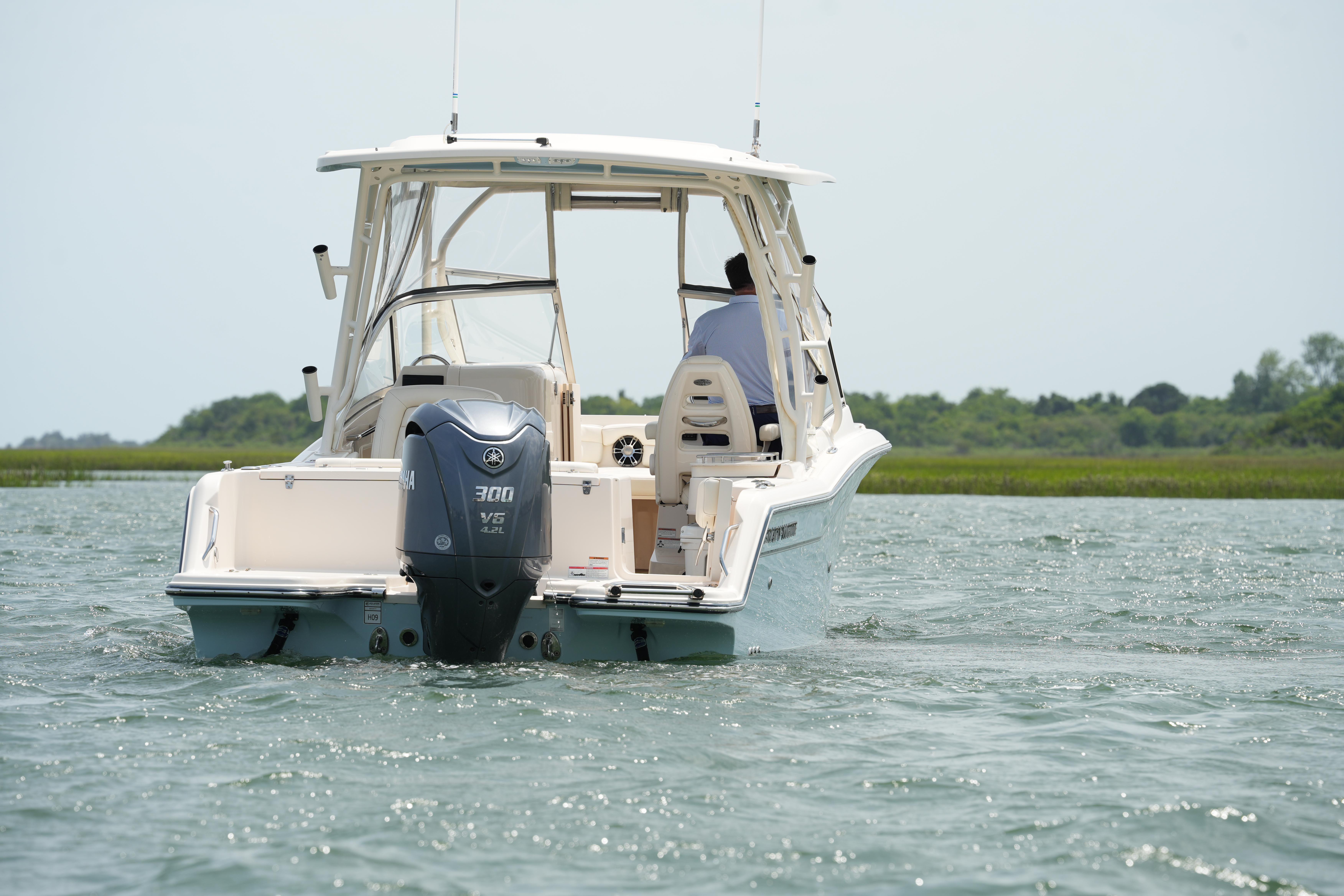 2021 Grady-White Freedom 235 boat on water, rear view with Yamaha 300 engine.
