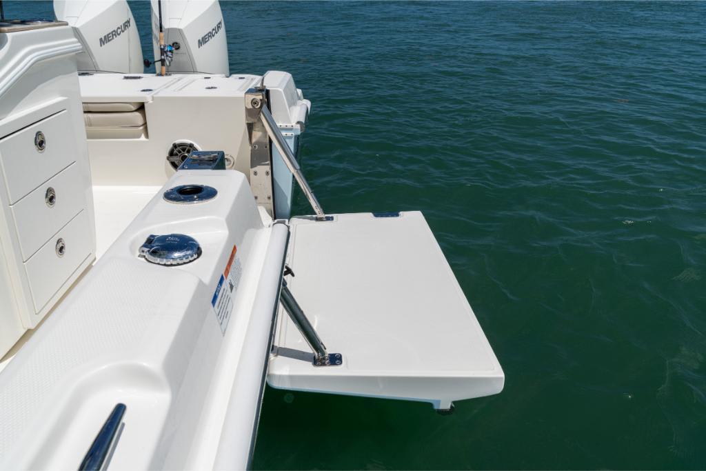 Boston Whaler 280 Dauntless 2024 boat with swim platform and Mercury engines.