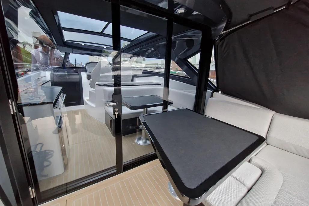 2024 Focus Power 44 yacht interior with modern seating and dining area.