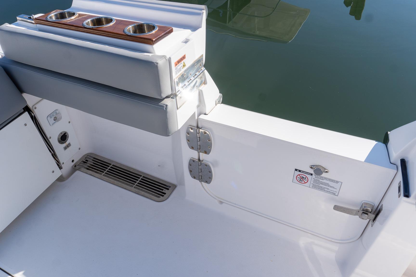 2024 Everglades 395 Center Console boat interior with cup holders and seating.