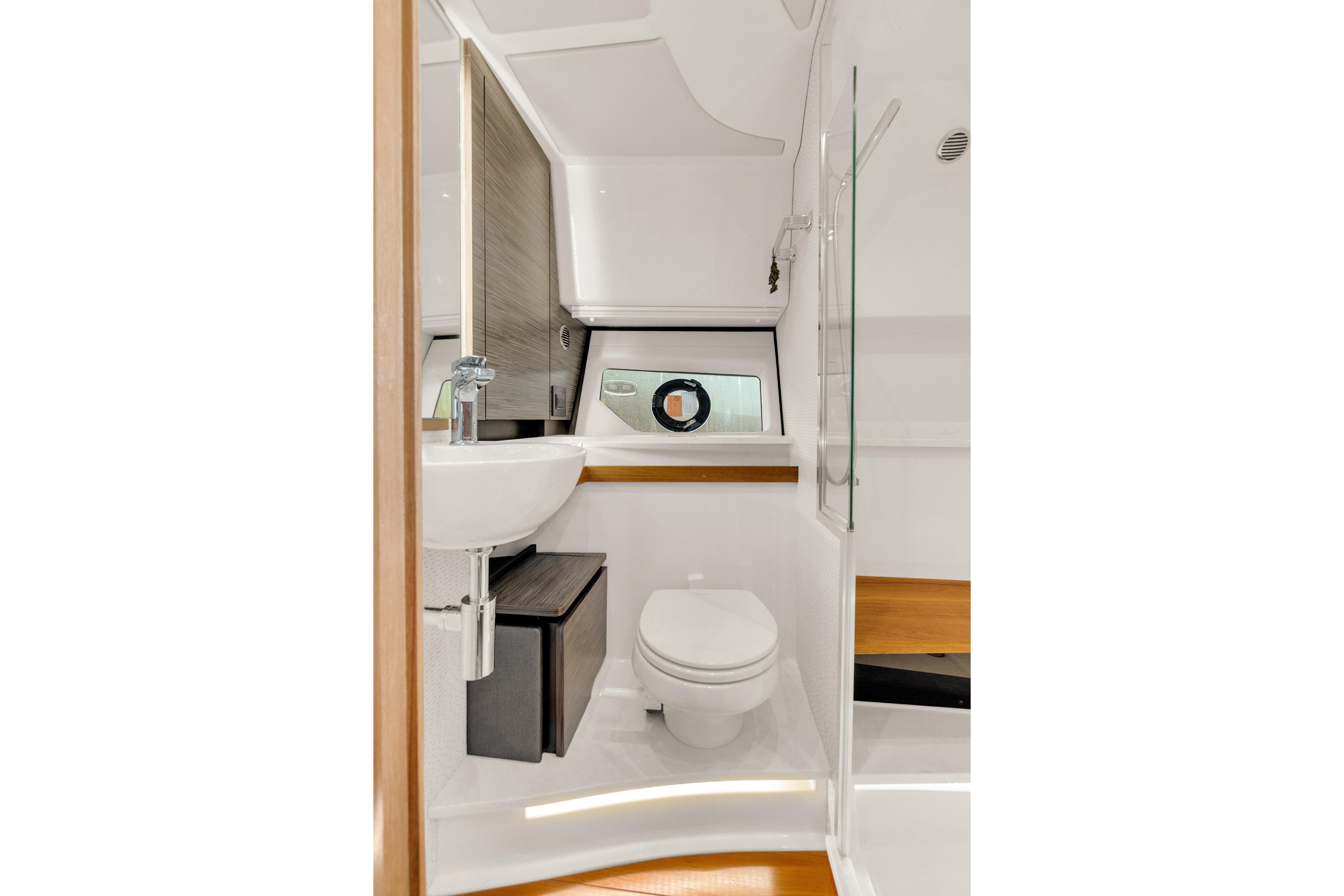 Luxurious bathroom interior of 2021 Tiara Sport 43 LE yacht, featuring modern fixtures.