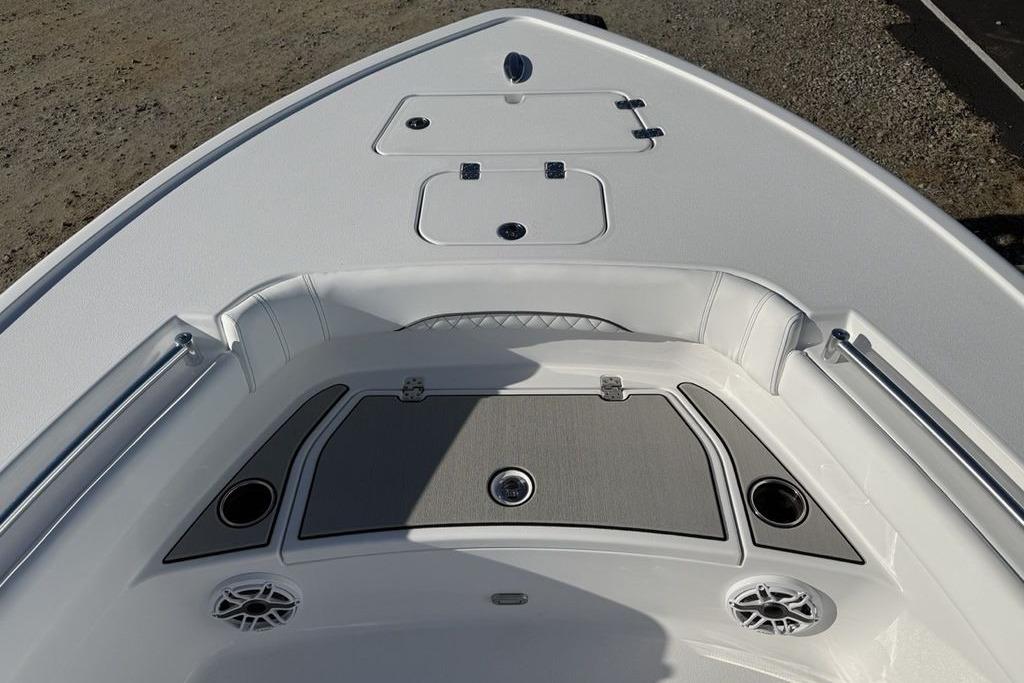 2026 Sportsman Masters 247OE Bay Boat bow with seating and storage compartments.