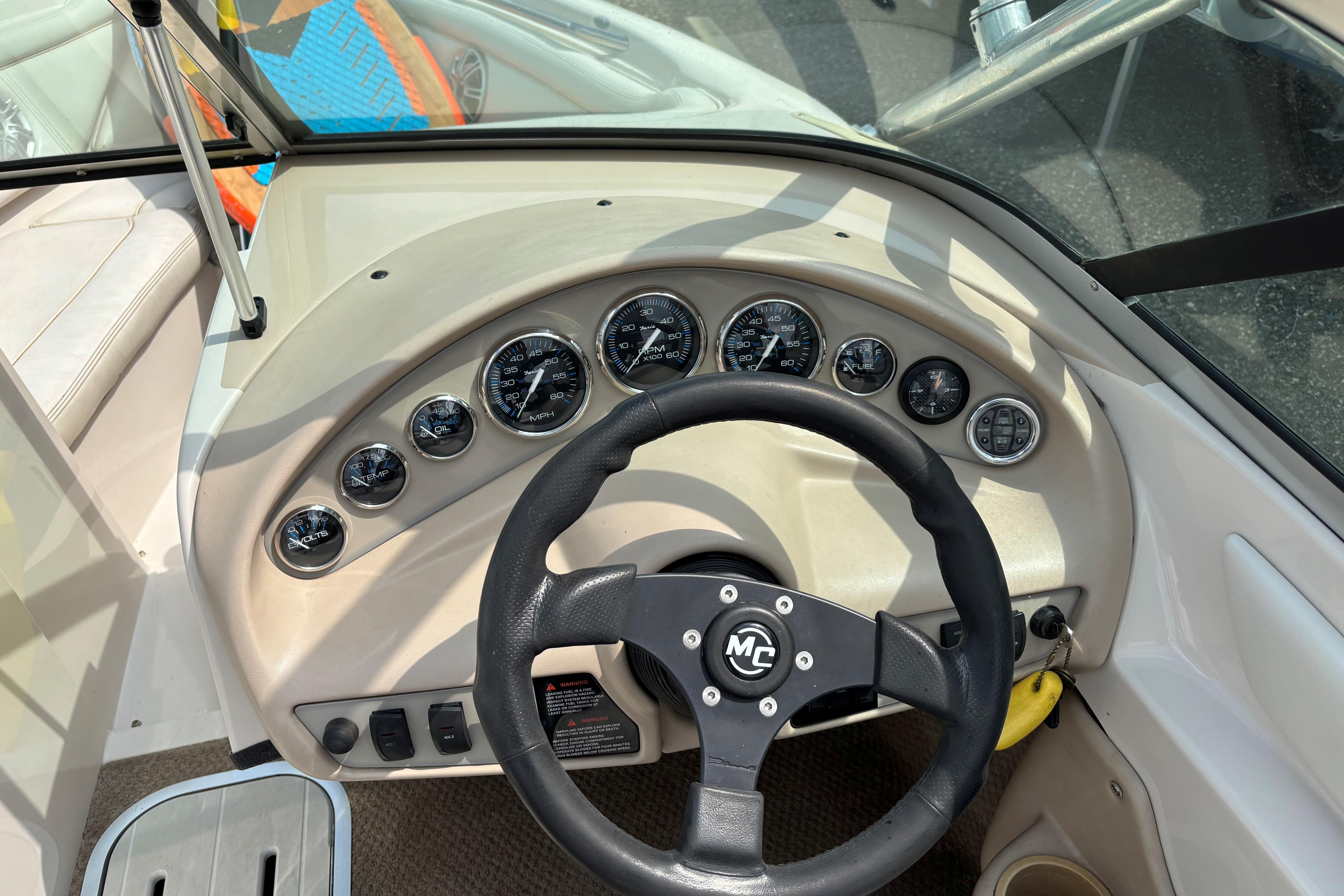 1999 MasterCraft 205 PRO STAR dashboard with steering wheel and gauges.