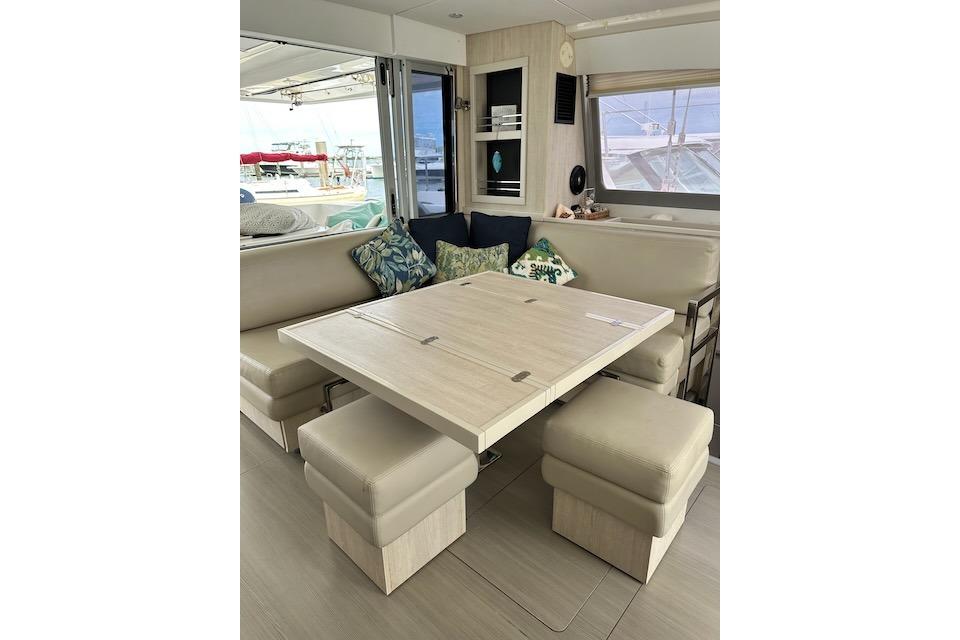 Interior of 2017 Leopard 40 catamaran with modern dining area and comfortable seating.