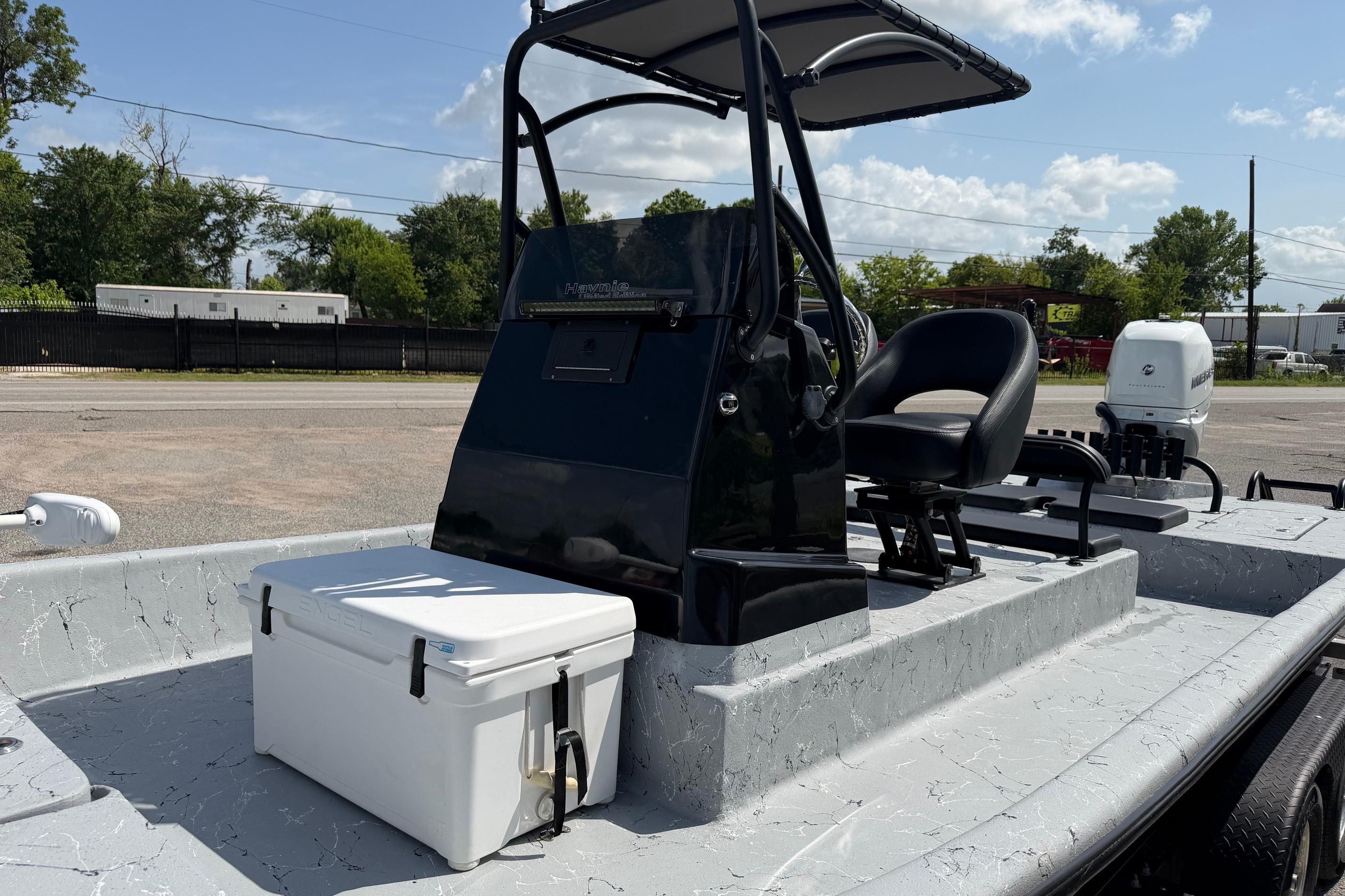 2023 Haynie 23 Super Cat boat with console, seat, and cooler on deck.