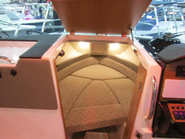 2025 Cutwater C-248 Coupe interior cabin with cushioned seating and ambient lighting.