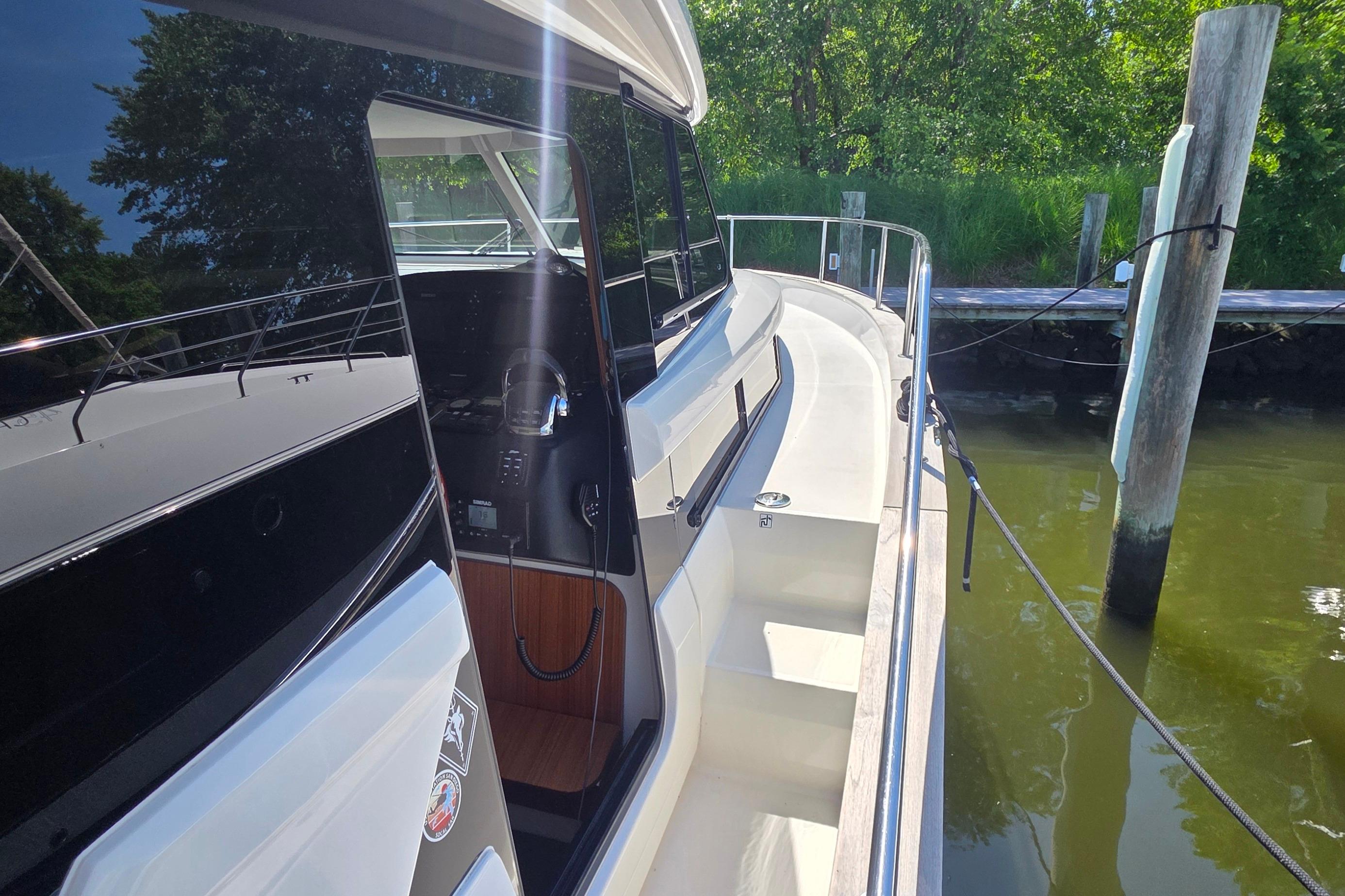 2023 Greenline 40 yacht docked, showcasing sleek design and modern features.