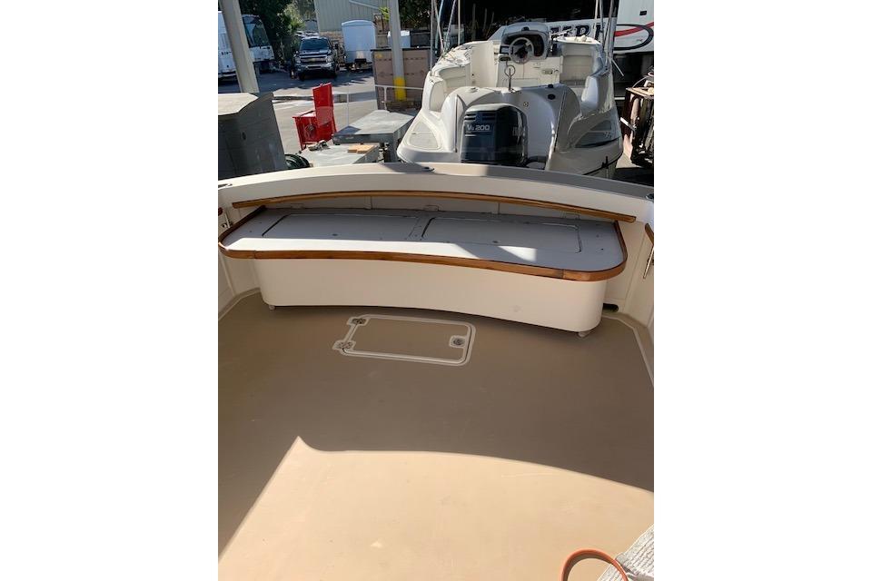 1999 Nauset Downeast Cruiser boat interior with seating and storage area.