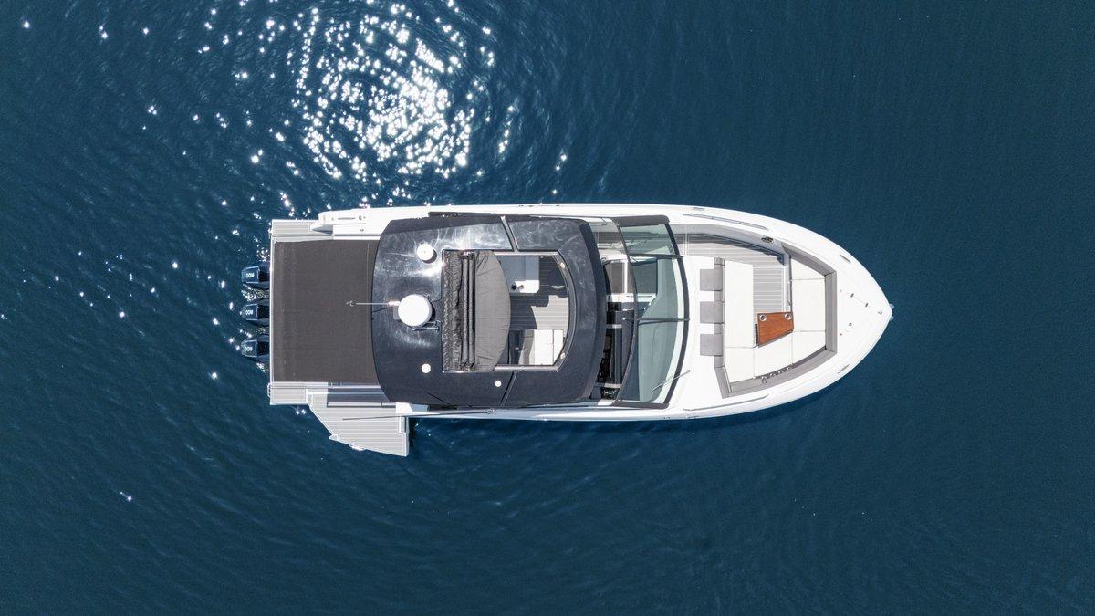Top view of 2021 Cruisers Yachts 38 GLS on calm blue water.